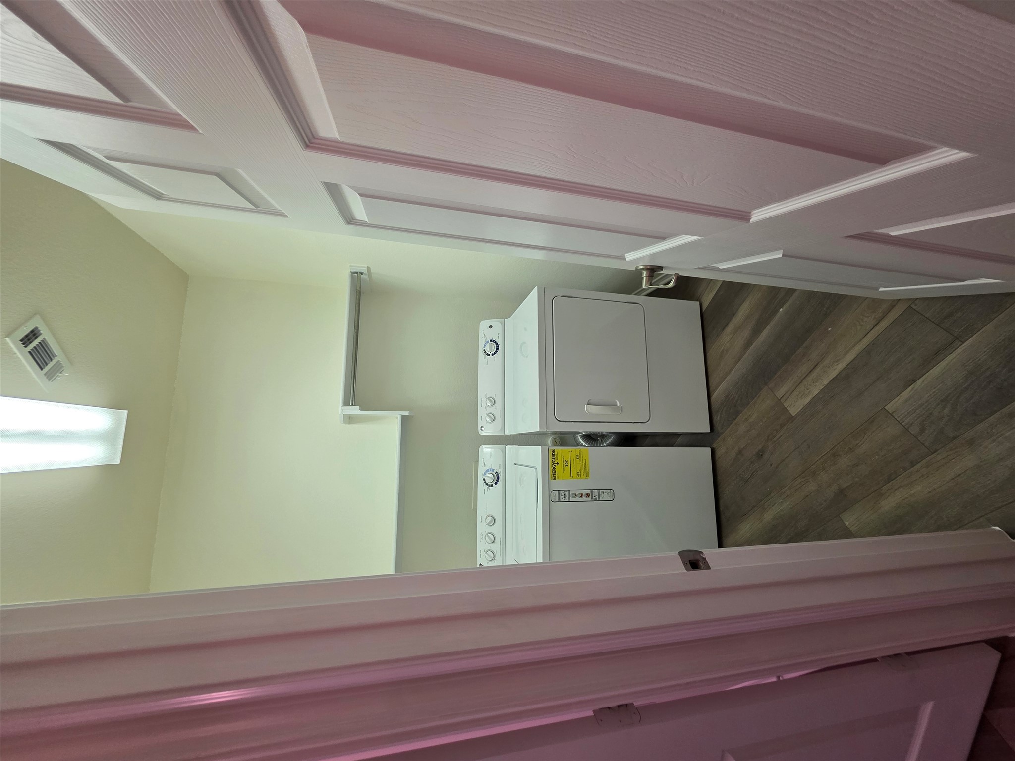 201 Yosemite Road Georgetown, TX 78633 - Photo 17 of 21 Laundry room with dark wood-type flooring and washer and clothes dryer