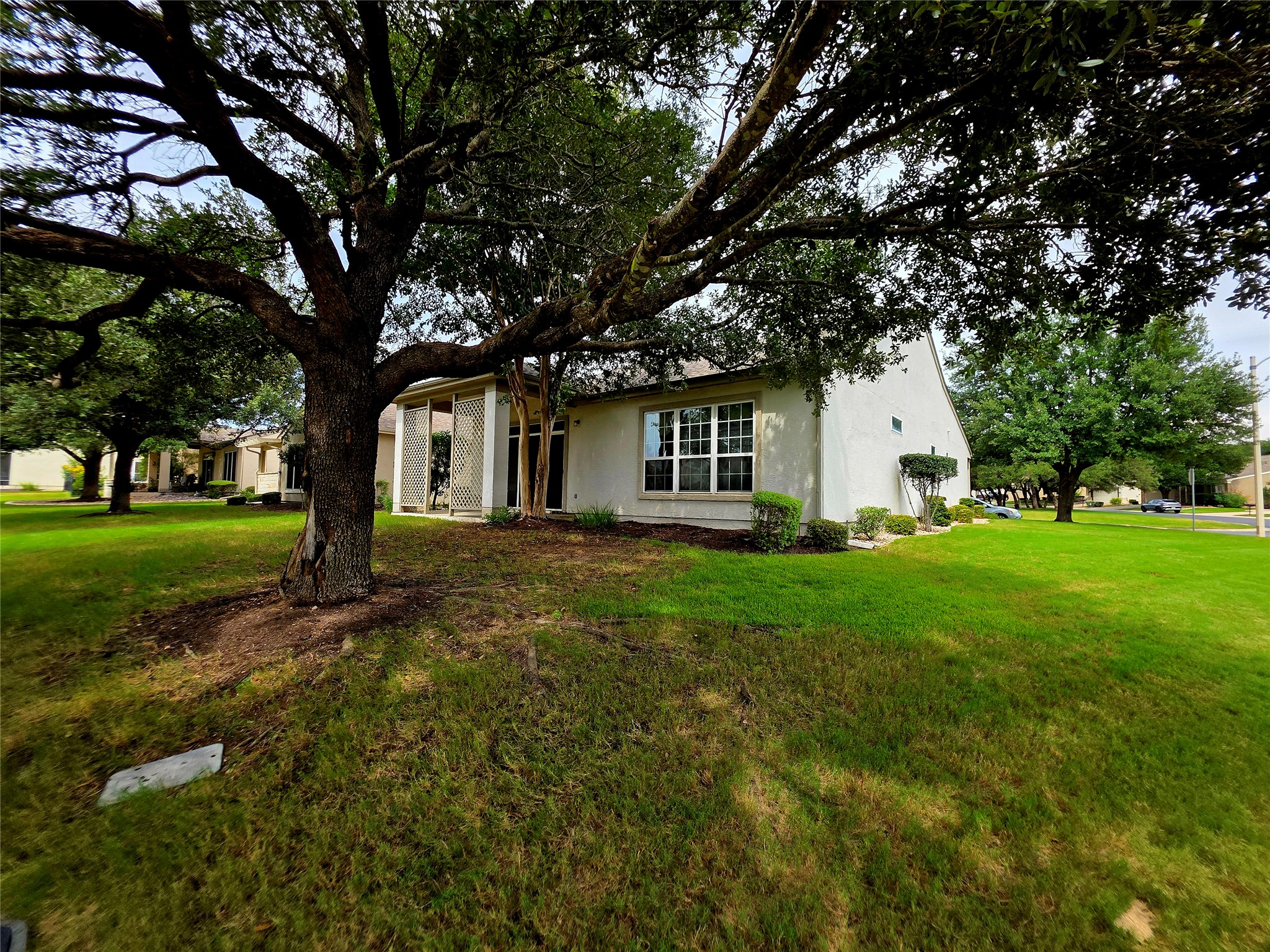 201 Yosemite Road Georgetown, TX 78633 - Photo 3 of 21 View of front of house featuring stucco siding and a front yard