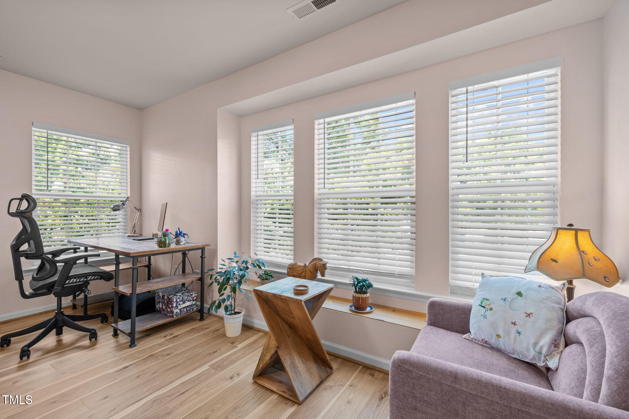 706 Delta Downs Drive Cary, NC 27519 - Photo 25 of 42 a living room with furniture and a large window