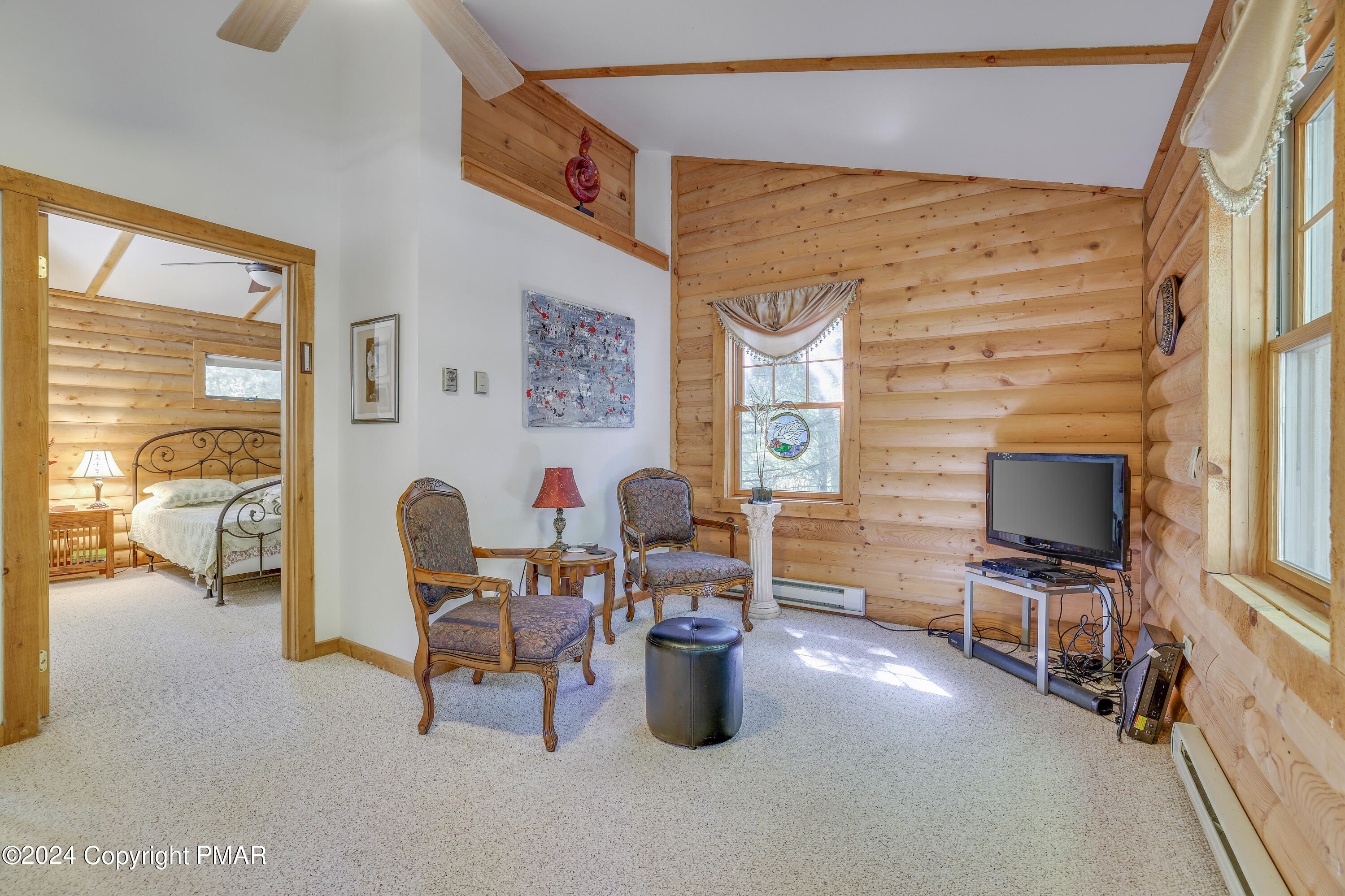 100 Ruffed Grouse Drive Shohola, PA 18458 - Photo 19 of 34 a living room with furniture and a flat screen tv
