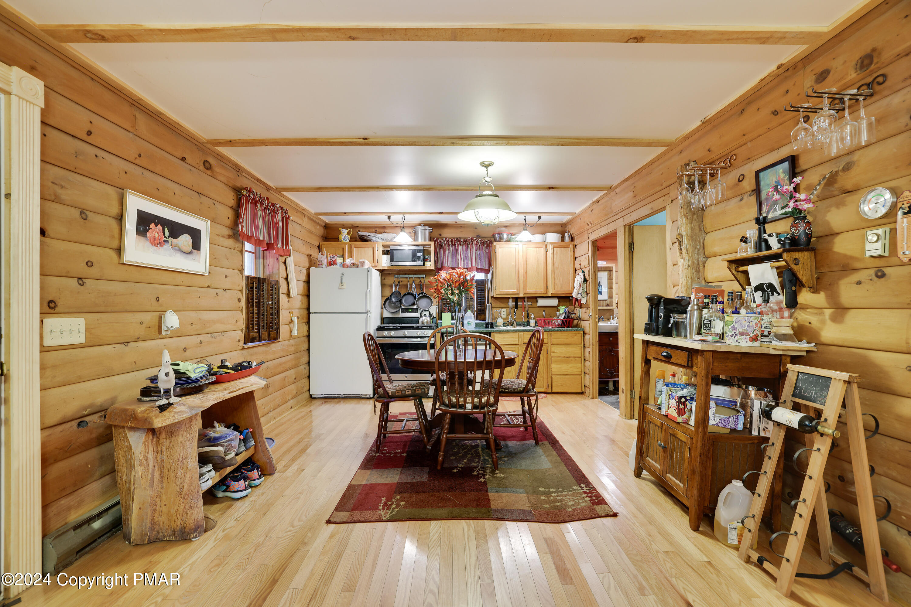 100 Ruffed Grouse Drive Shohola, PA 18458 - Photo 2 of 34 a view of a room with lots of wooden furniture