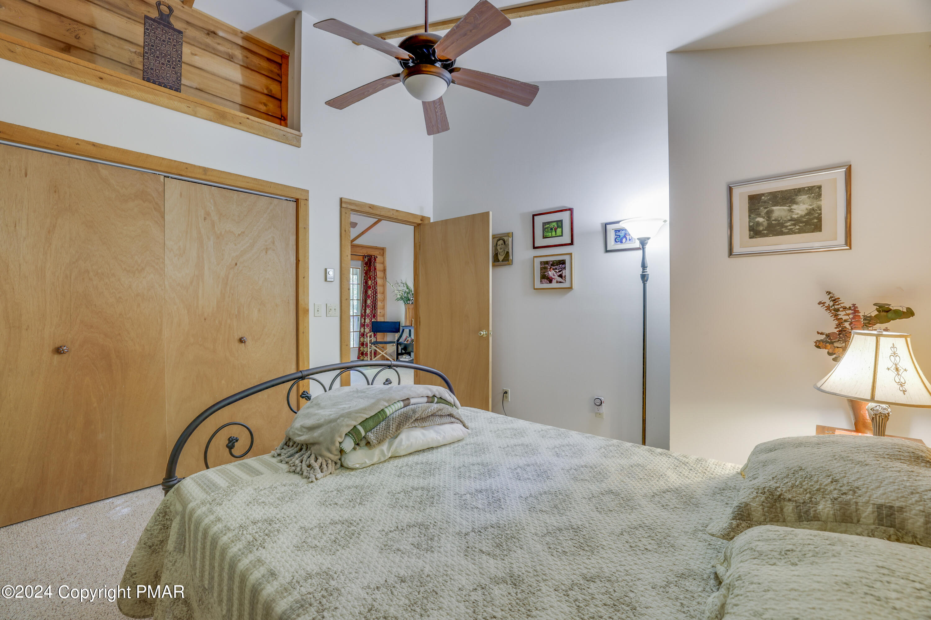 100 Ruffed Grouse Drive Shohola, PA 18458 - Photo 22 of 34 a bedroom with a bed and a dresser