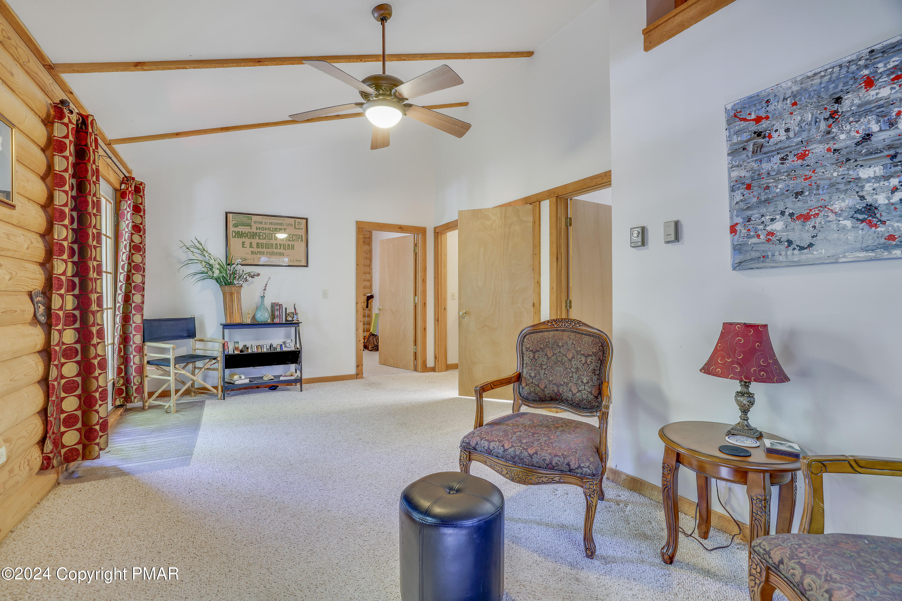 100 Ruffed Grouse Drive Shohola, PA 18458 - Photo 23 of 34 a living room with furniture and a flat screen tv