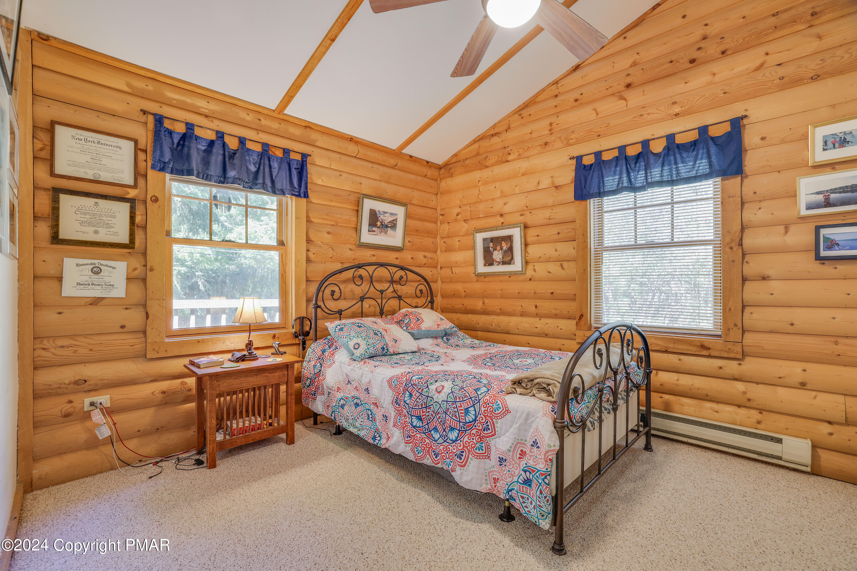 100 Ruffed Grouse Drive Shohola, PA 18458 - Photo 24 of 34 a bed room with a bed and a couch