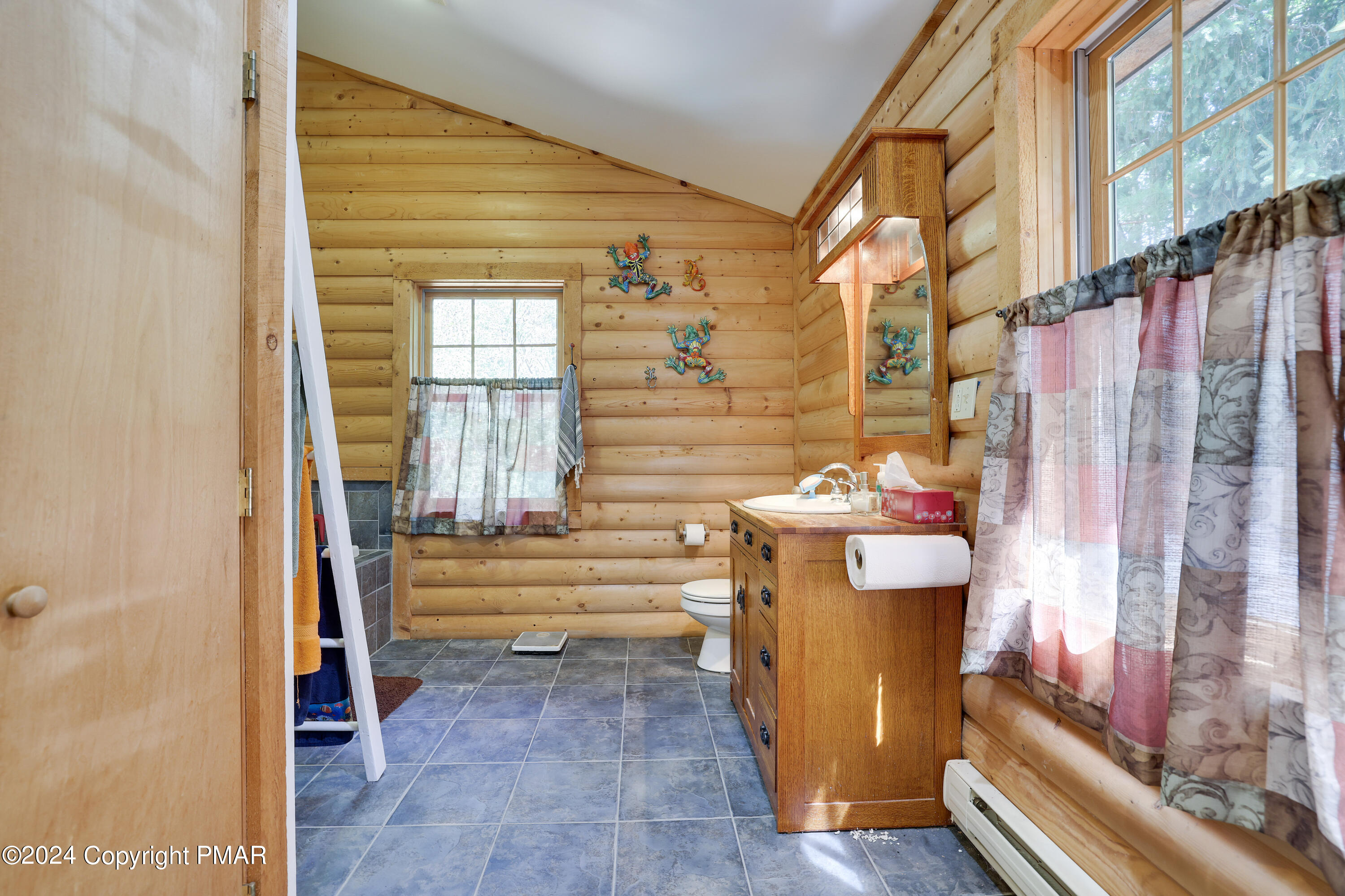 100 Ruffed Grouse Drive Shohola, PA 18458 - Photo 27 of 34 a bathroom with a sink and a mirror