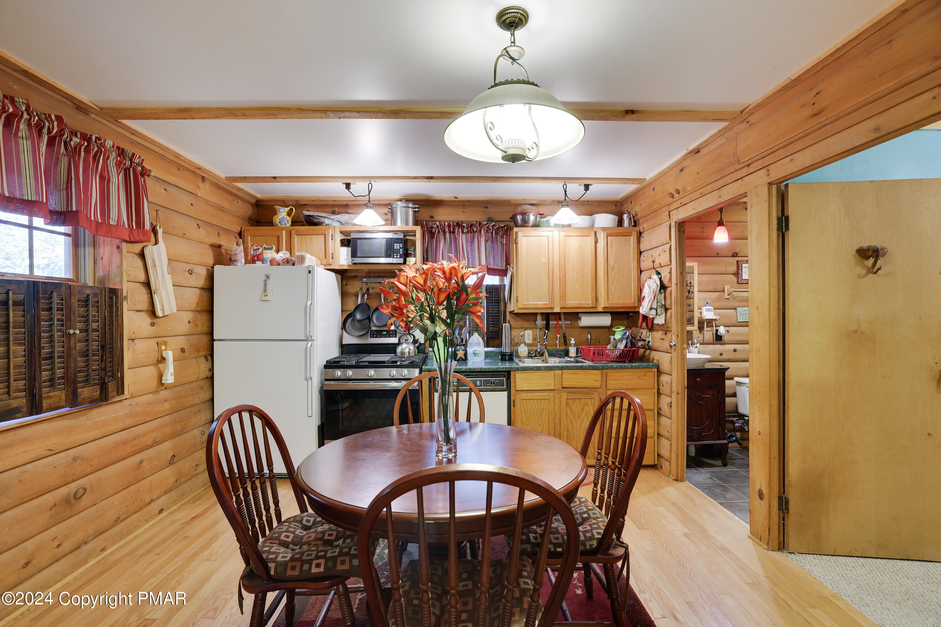 100 Ruffed Grouse Drive Shohola, PA 18458 - Photo 3 of 34 a view of a dining room with furniture and chandelier