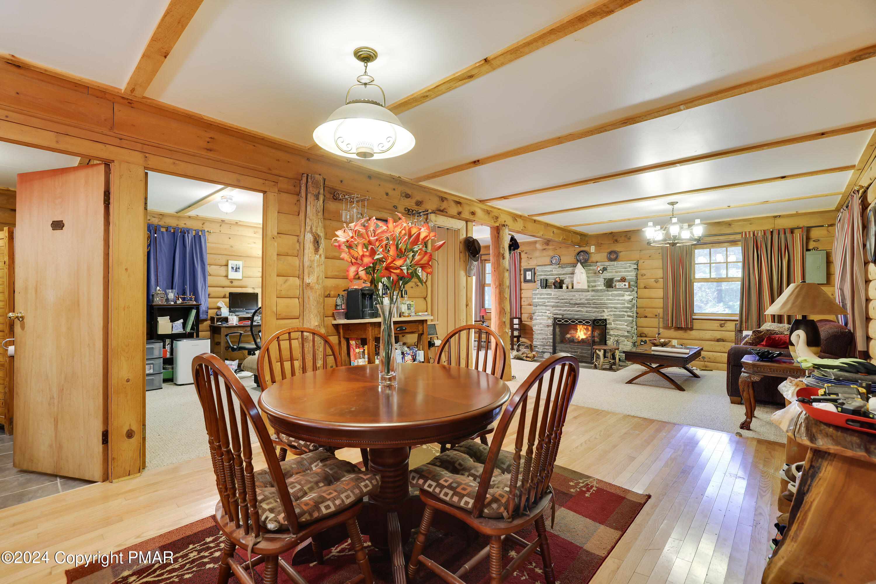 100 Ruffed Grouse Drive Shohola, PA 18458 - Photo 4 of 34 a dining room with furniture window and wooden floor