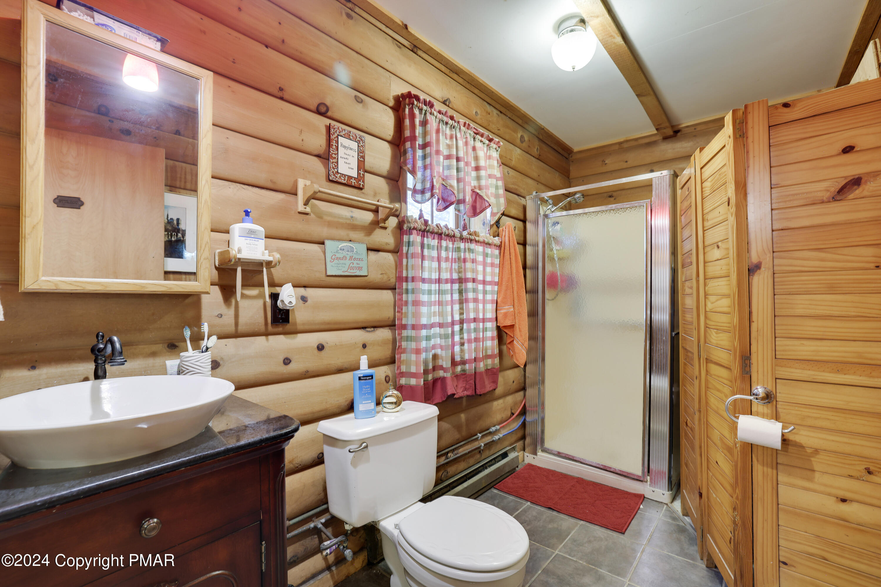 100 Ruffed Grouse Drive Shohola, PA 18458 - Photo 5 of 34 a bathroom with a sink a toilet and shower