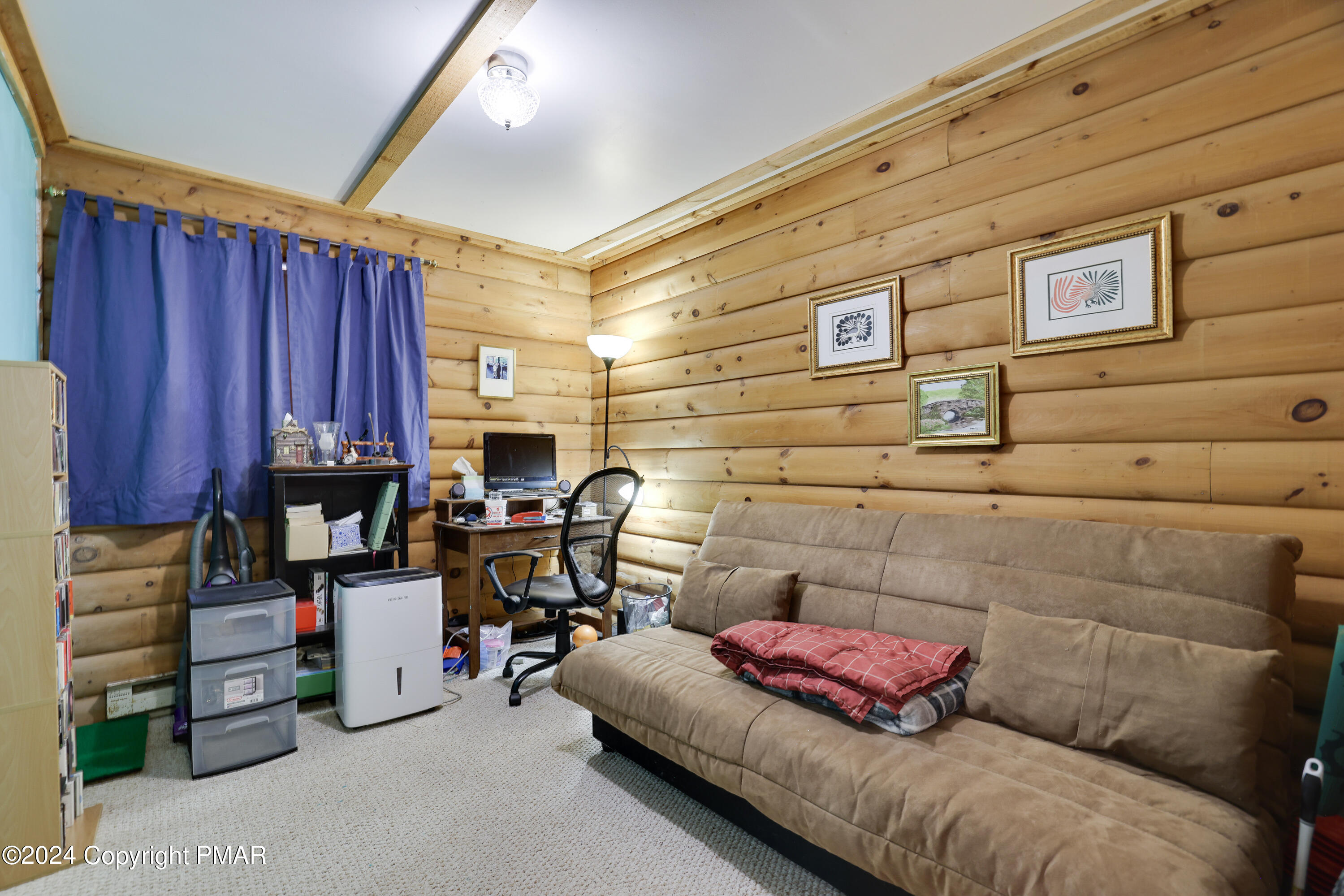 100 Ruffed Grouse Drive Shohola, PA 18458 - Photo 6 of 34 a living room with furniture and a fireplace