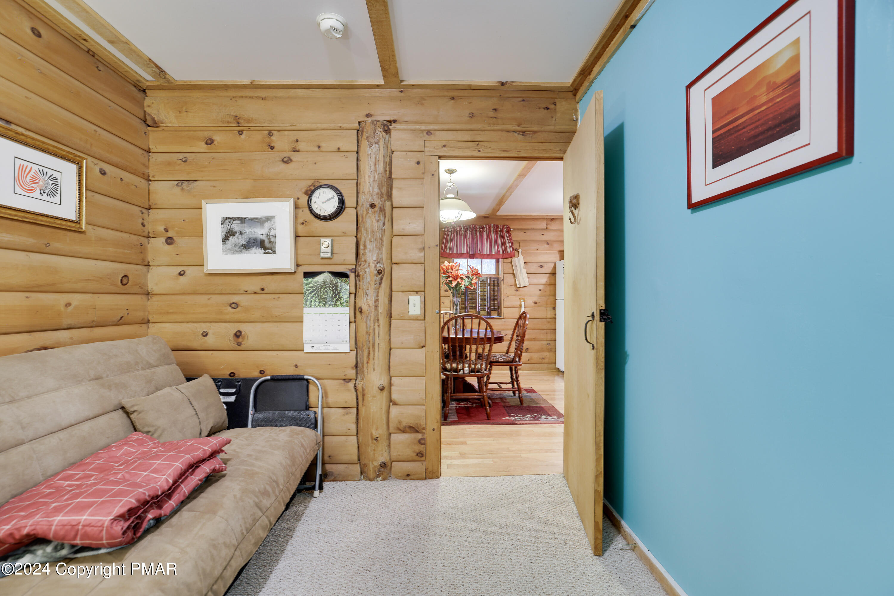 100 Ruffed Grouse Drive Shohola, PA 18458 - Photo 7 of 34 a bedroom with a bed and a table