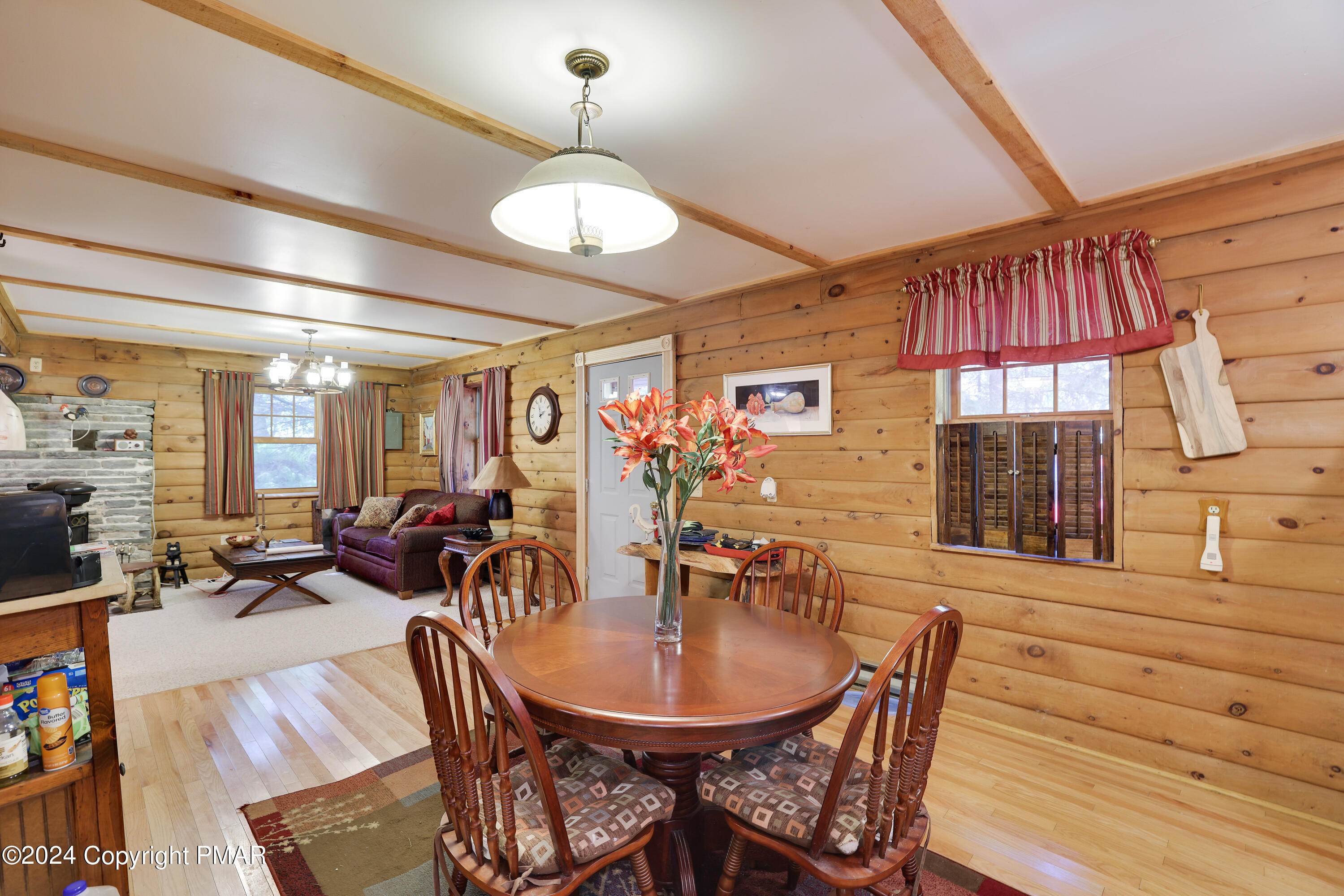 100 Ruffed Grouse Drive Shohola, PA 18458 - Photo 8 of 34 a view of a dining room with furniture window and outside view
