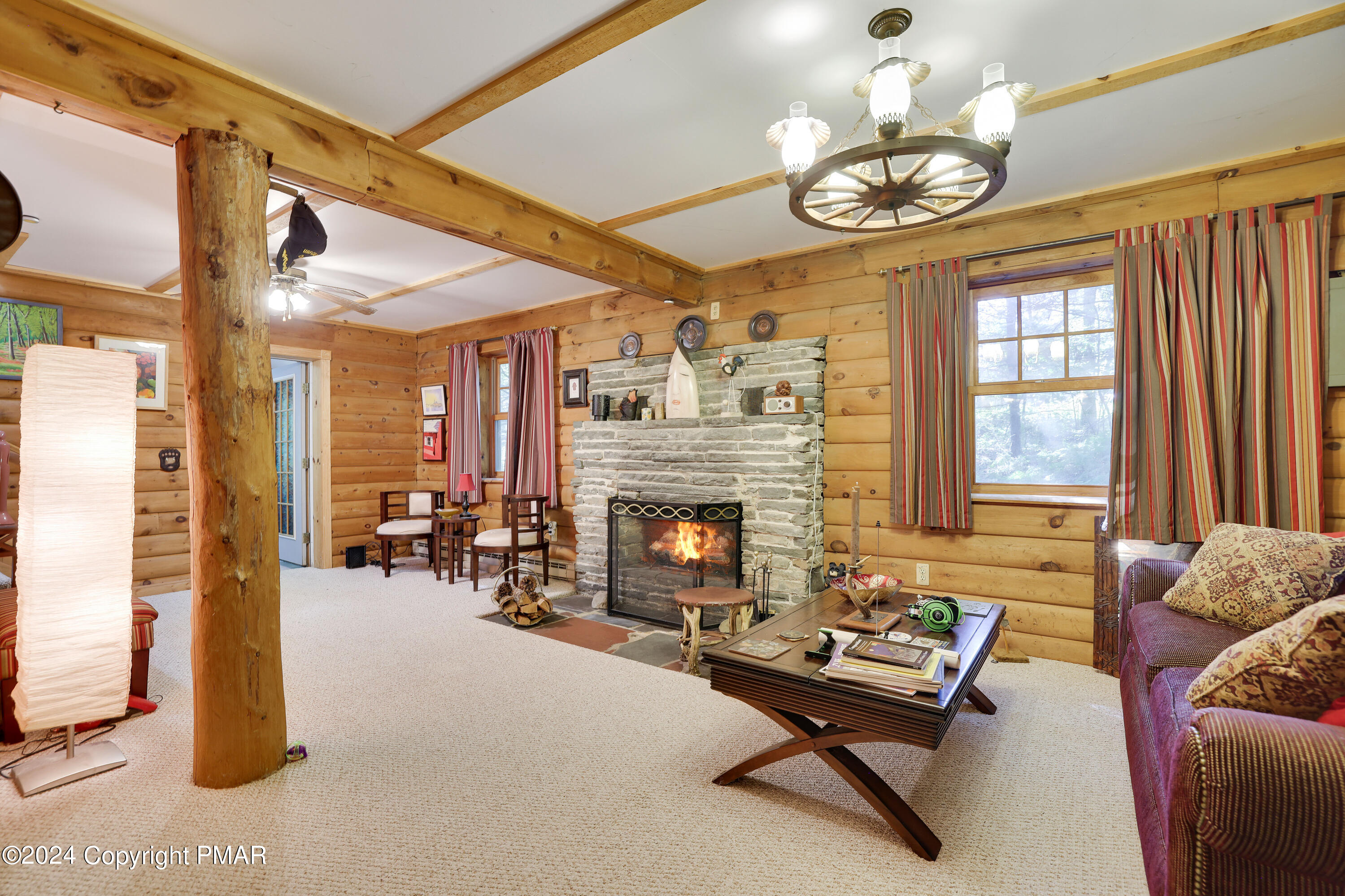100 Ruffed Grouse Drive Shohola, PA 18458 - Photo 9 of 34 a living room with furniture a fireplace and window