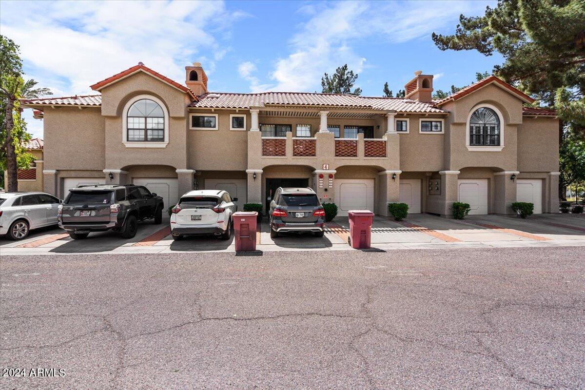 8300 East Vía De Ventura, Unit 1015 Scottsdale, AZ 85258 - Photo 15 of 26 a couple of cars parked in front of a house
