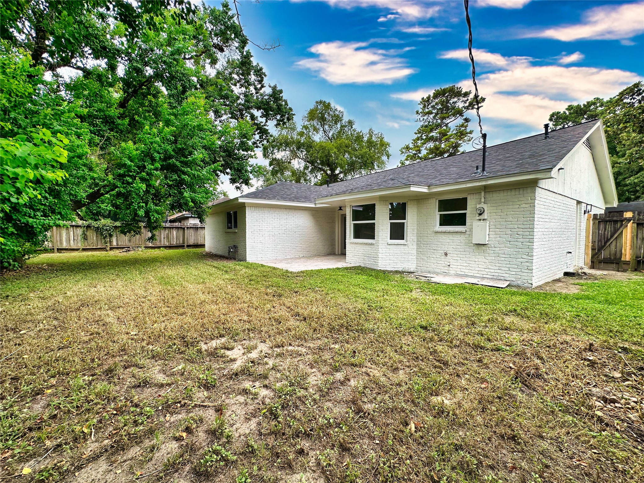 29310 Loddington Street Spring, TX 77386 - Photo 22 of 23 a view of a house with a backyard