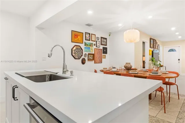 a kitchen with stainless steel appliances a sink and a stove