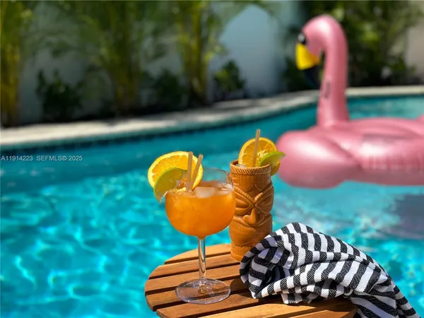 a view of swimming pool with a patio