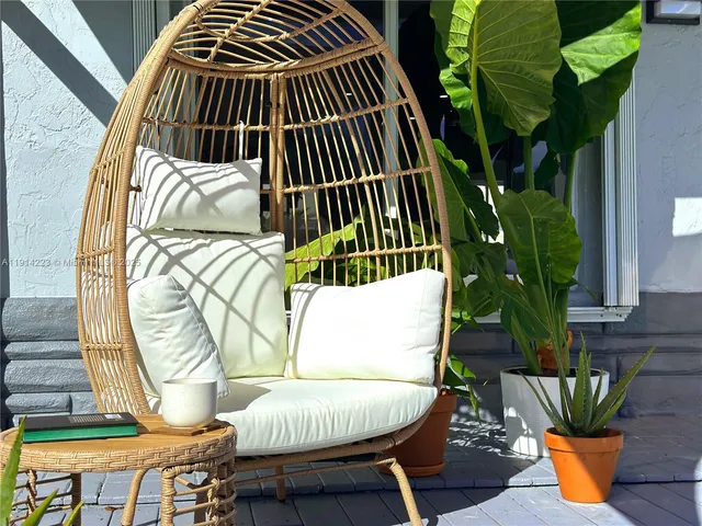 a view of balcony with floor to ceiling window and outdoor kitchen