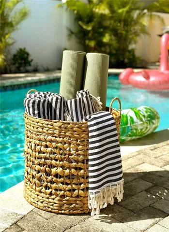 a view of house with backyard and patio