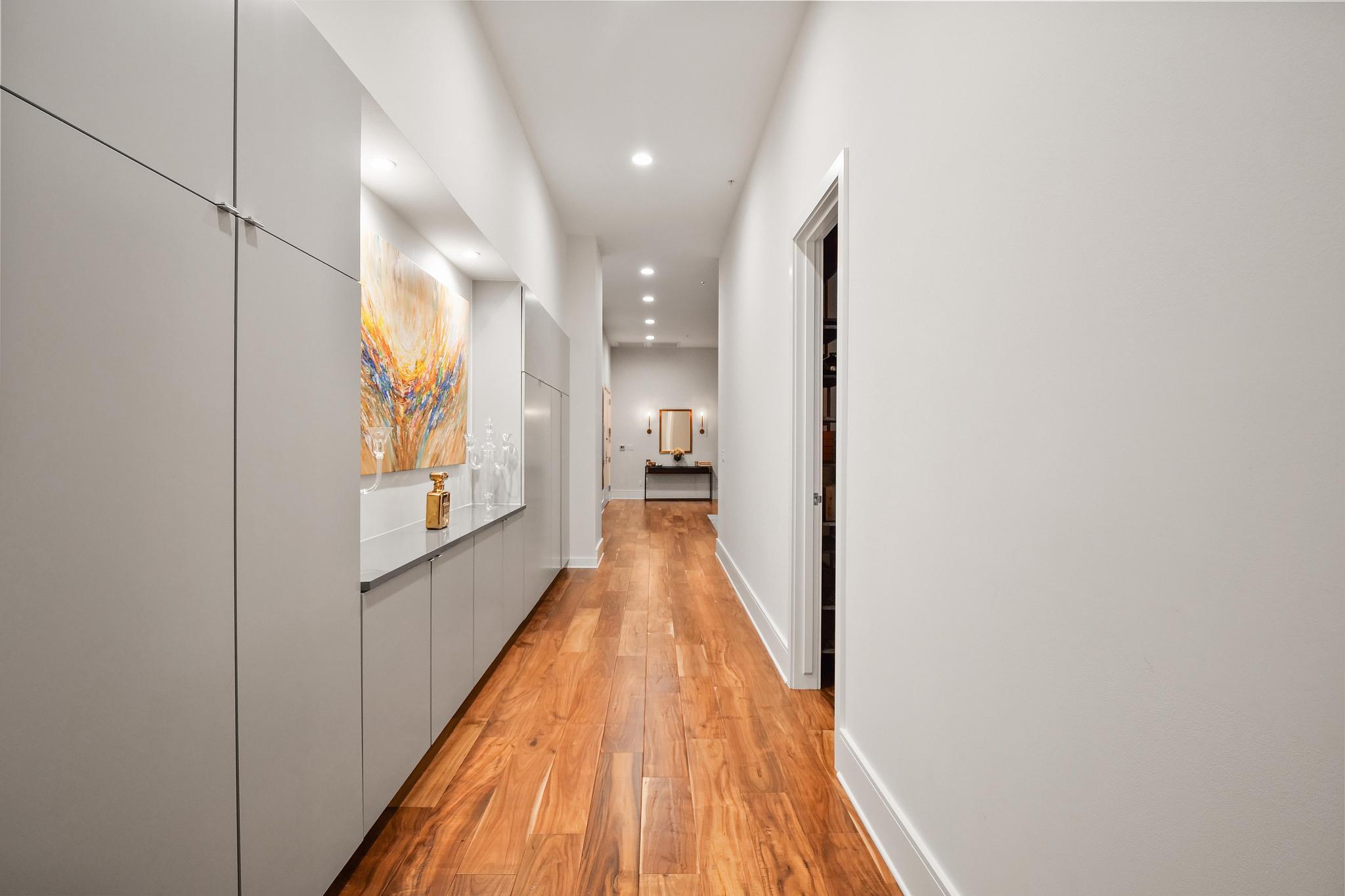 555 East 5th Street, Unit 3022 Austin, TX 78701 - Photo 28 of 40 Hallway with recessed lighting and light wood-style flooring