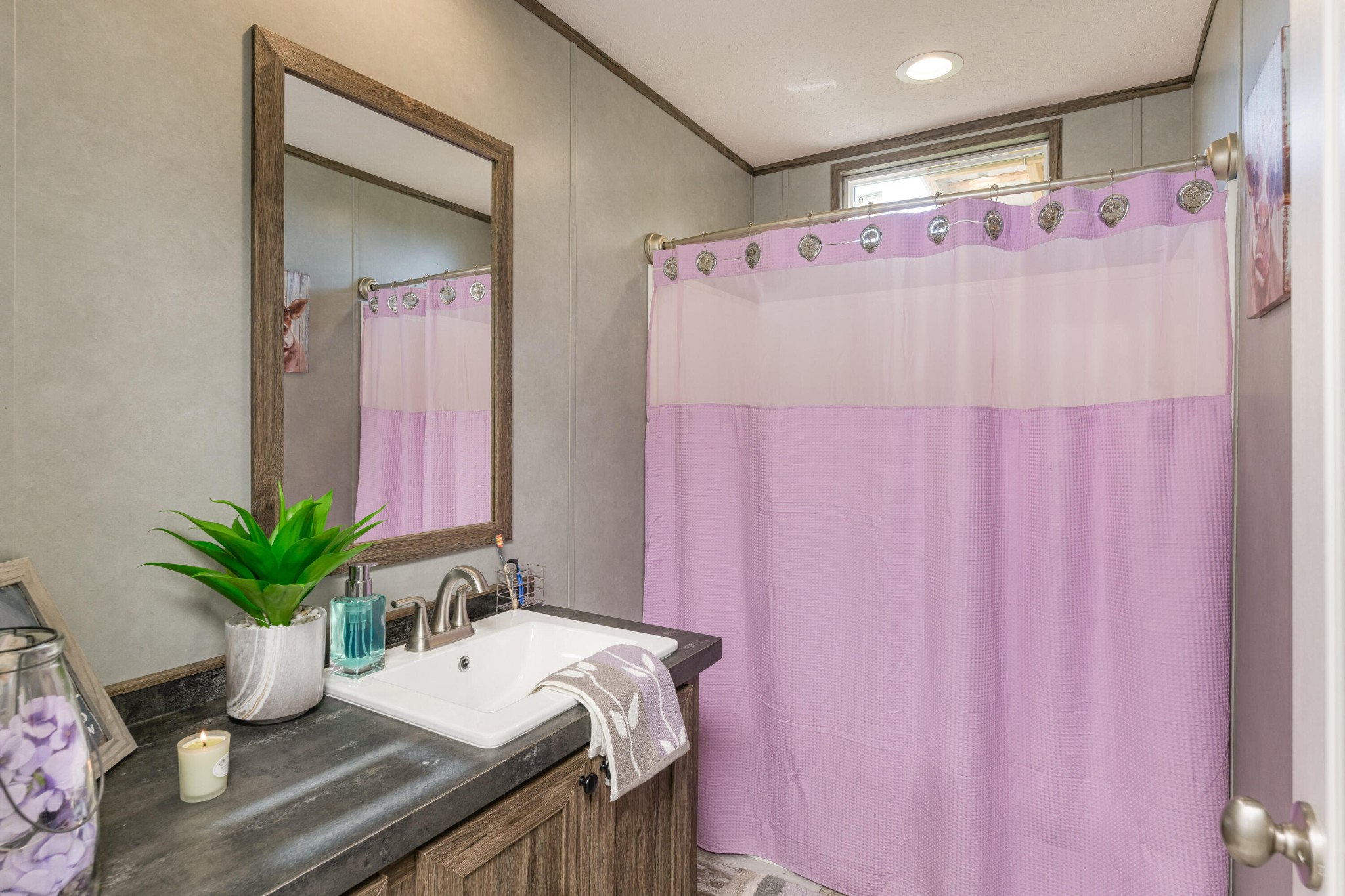 450 Cottonport Ridge Road Decatur, TN 37322 - Photo 15 of 51 a bathroom with a sink a mirror and a shower curtain