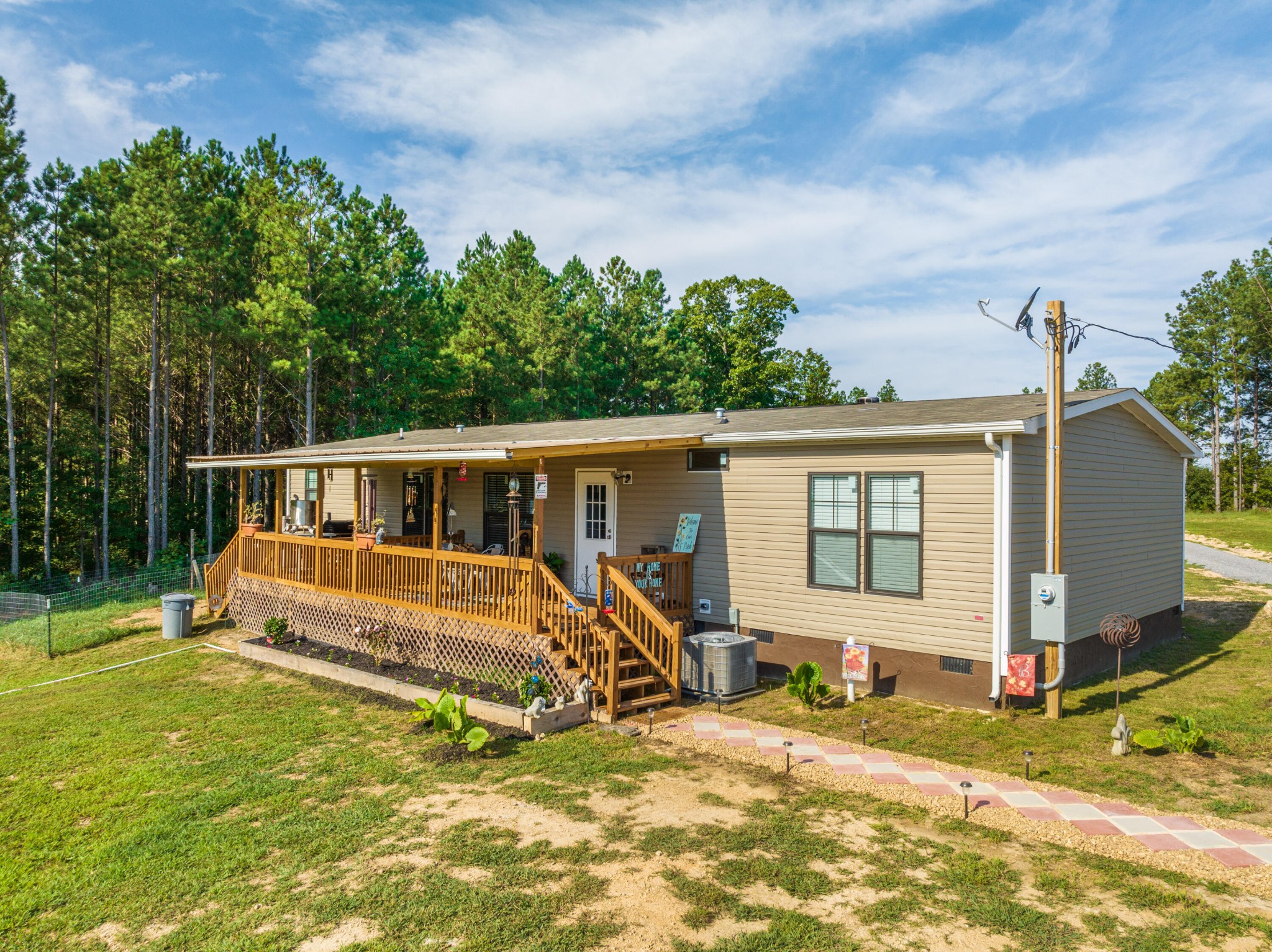450 Cottonport Ridge Road Decatur, TN 37322 - Photo 3 of 51 a view of a house with backyard sitting area and garden
