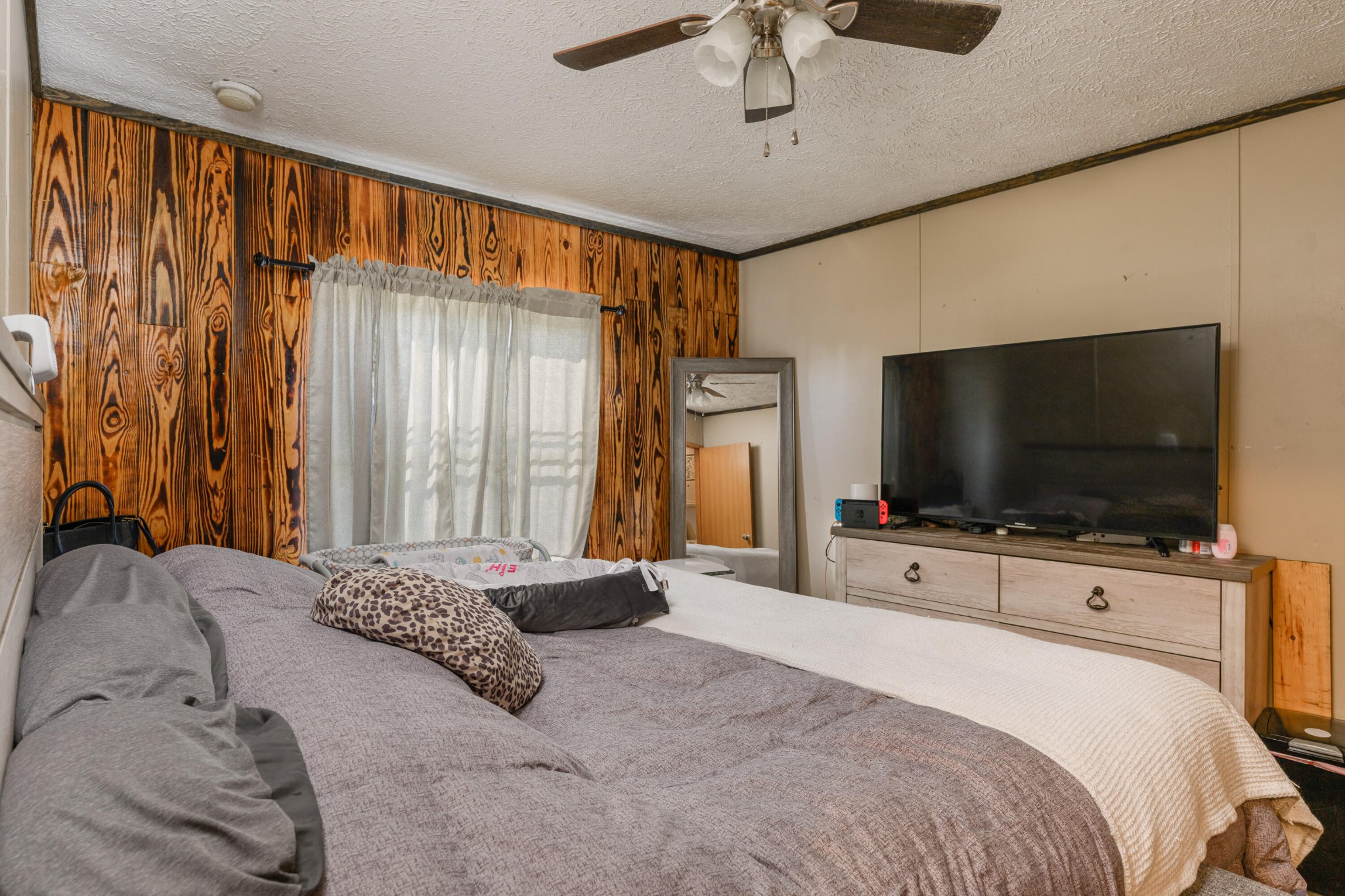 450 Cottonport Ridge Road Decatur, TN 37322 - Photo 40 of 51 a bedroom with a bed and a flat screen tv