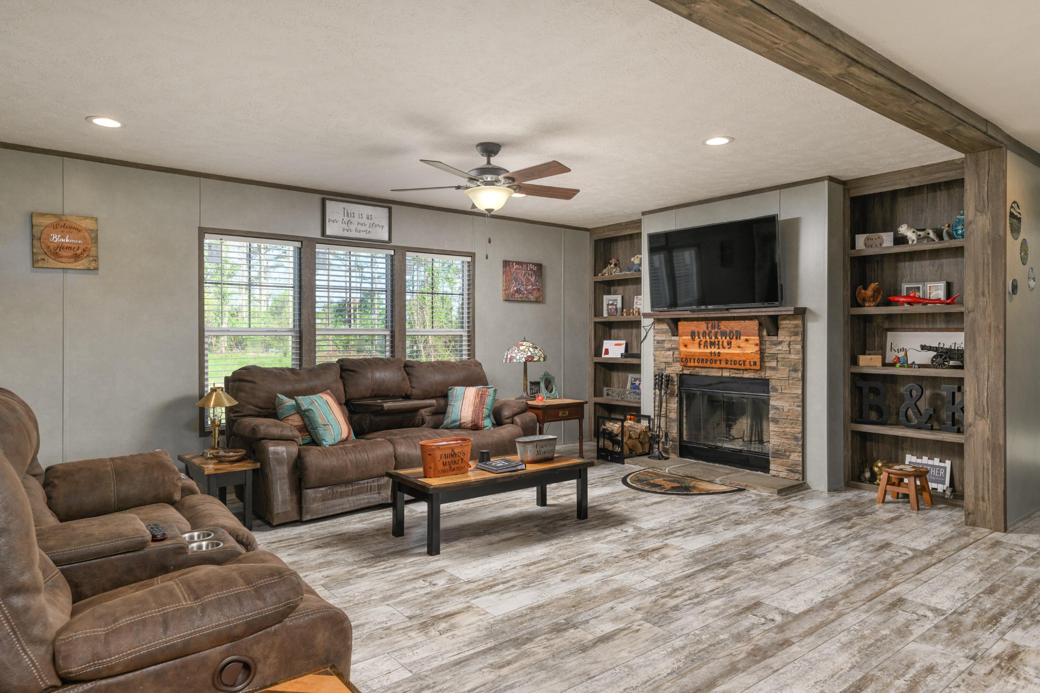 450 Cottonport Ridge Road Decatur, TN 37322 - Photo 8 of 51 a living room with furniture a flat screen tv and a fireplace