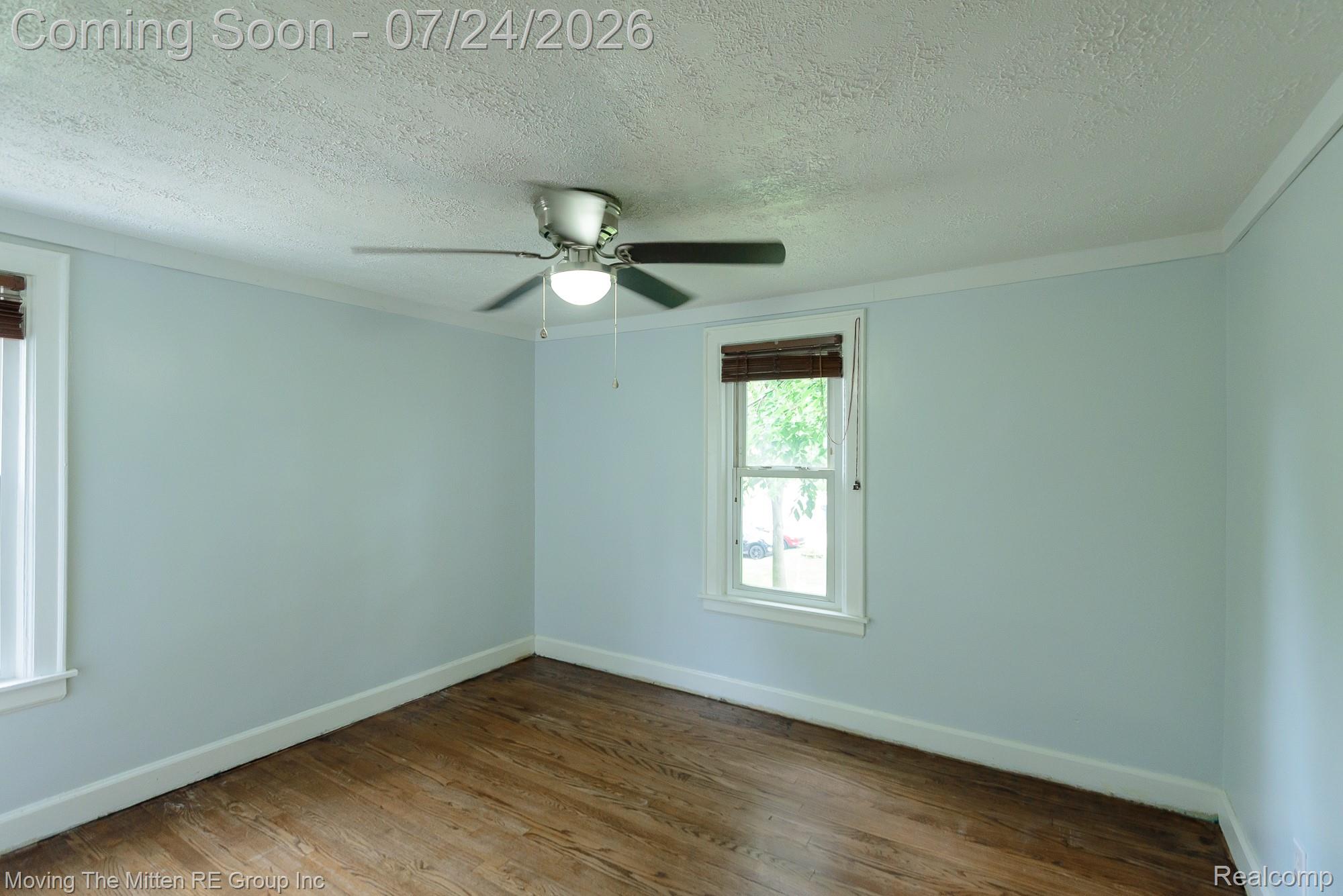 2037 Vivian Road Monroe, MI 48162 - Photo 15 of 39 Hardwood-finish flooring complements light blue walls and white trim
