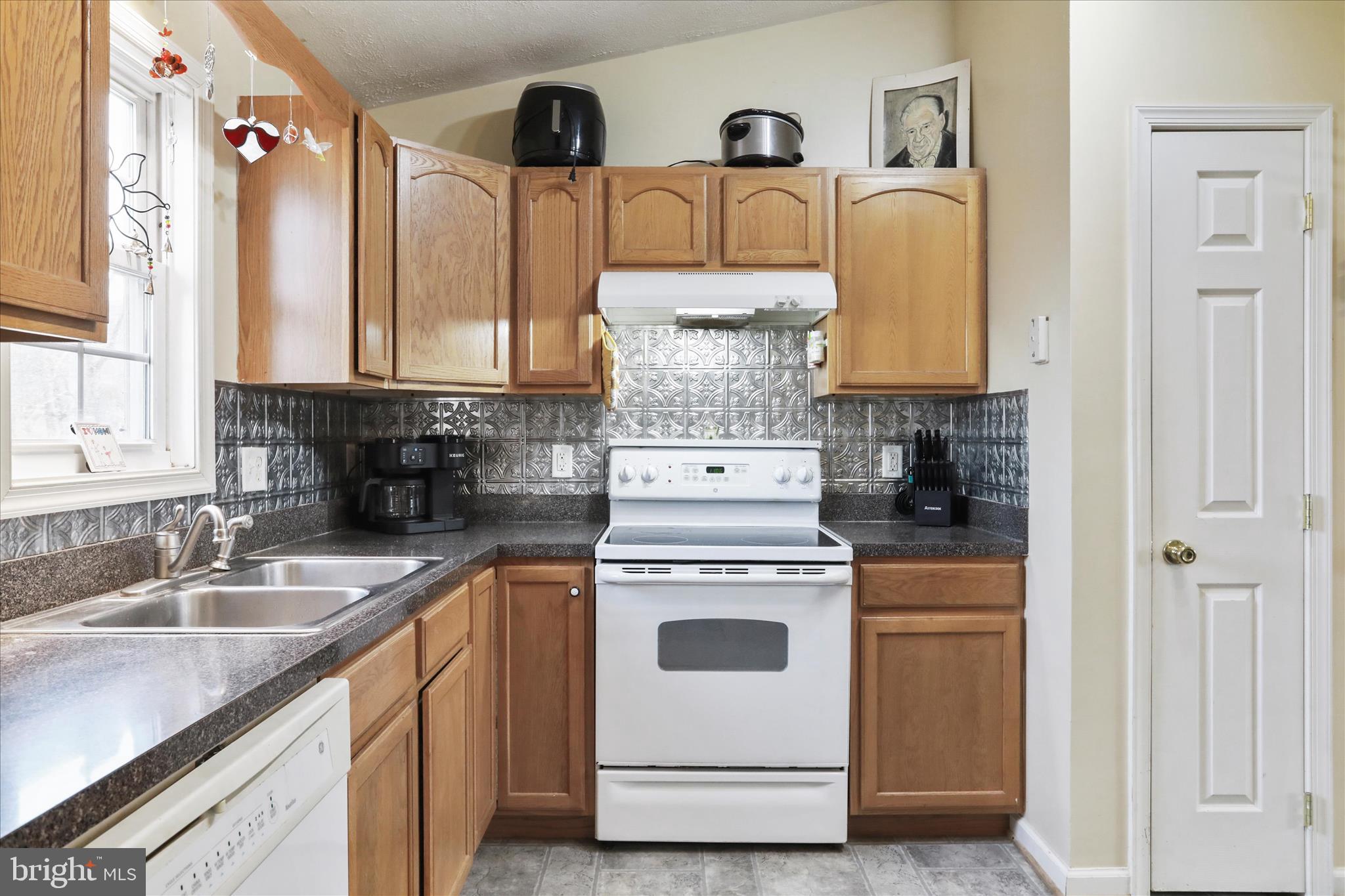 40 Lookout Point Way Linden, VA 22642 - Photo 12 of 36 a kitchen with appliances a sink and cabinets
