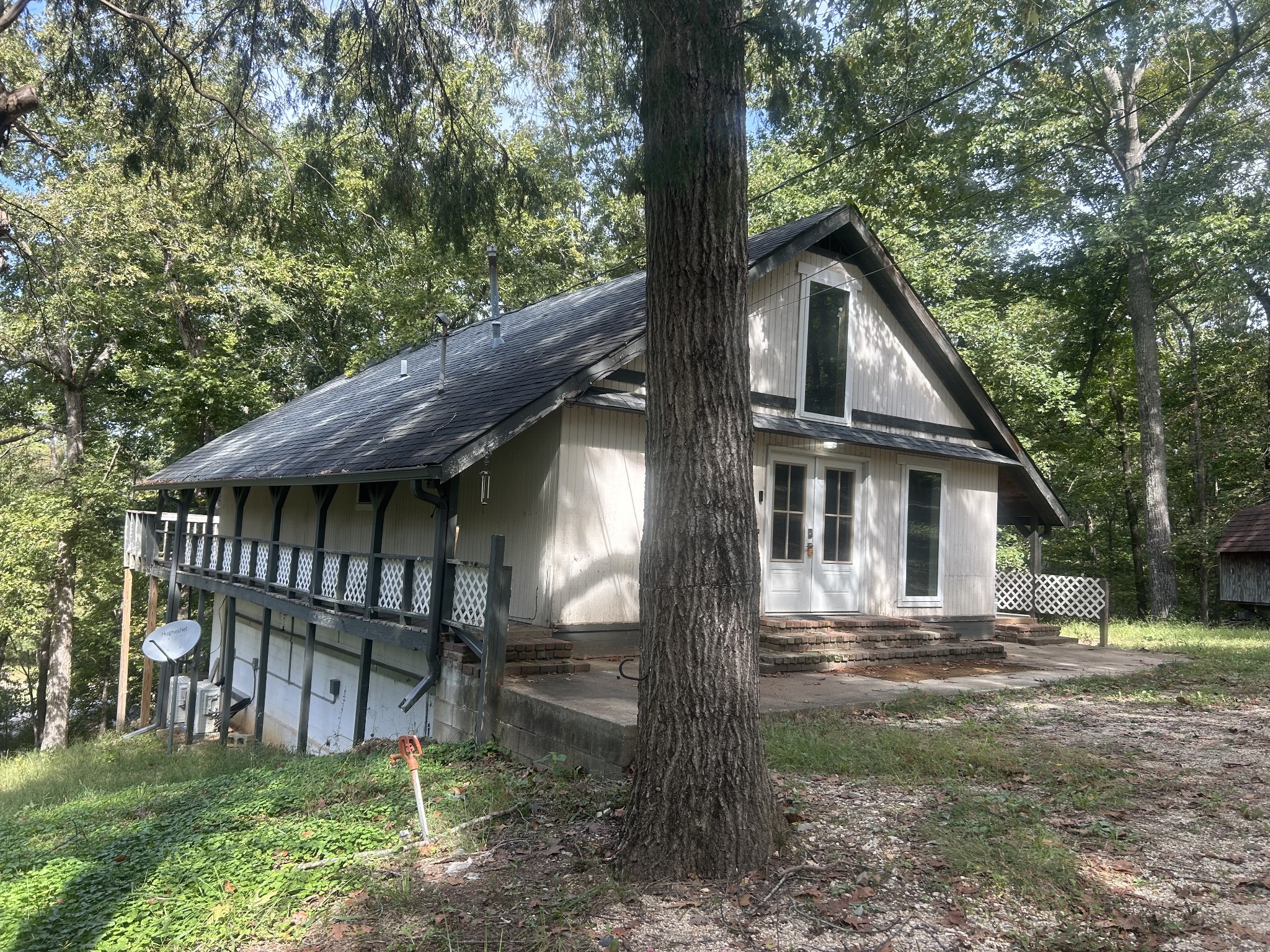 370 Alpine Road Camden, TN 38320 - Photo 2 of 20 a view of a house with a yard and wooden fence