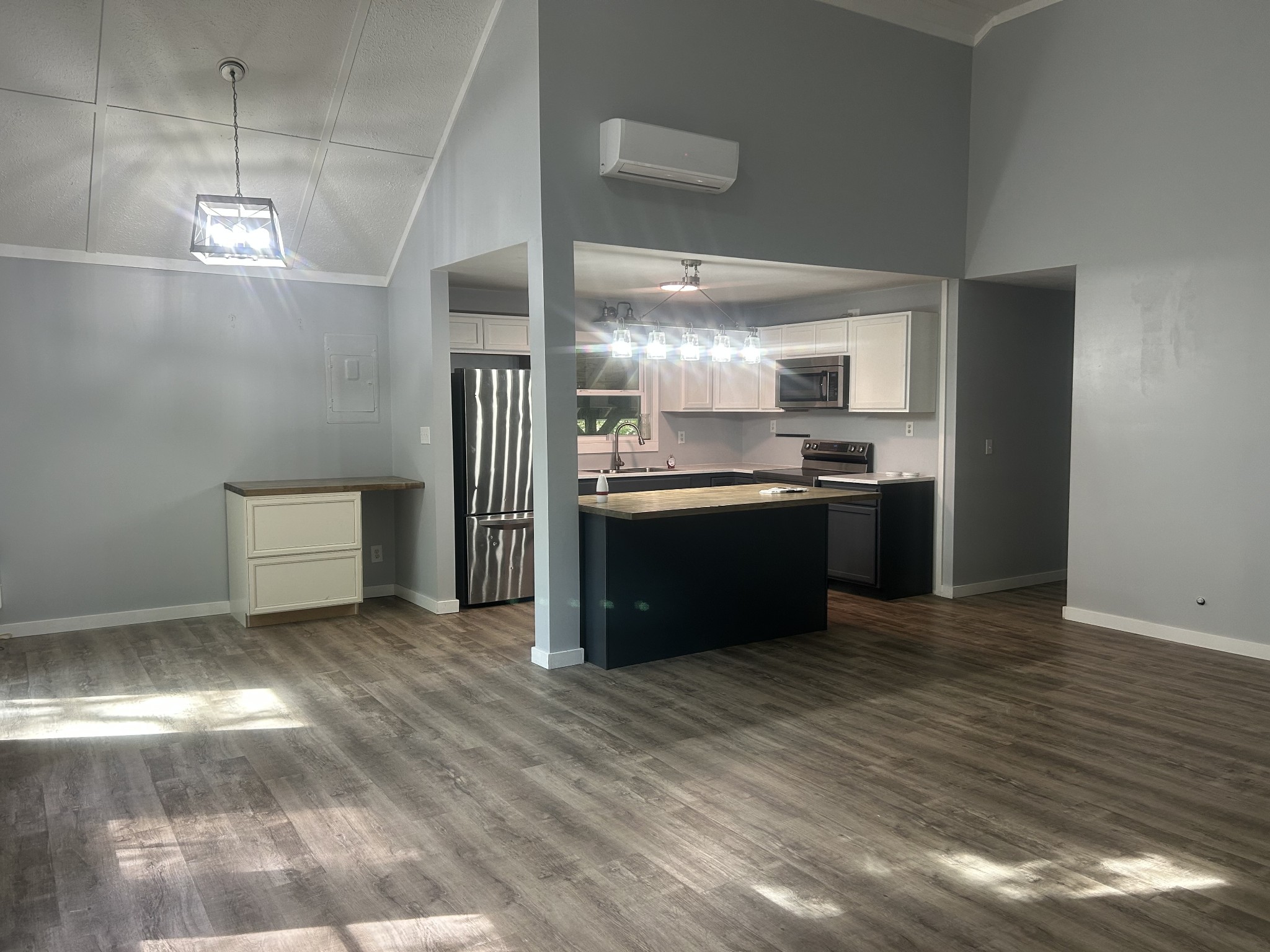 370 Alpine Road Camden, TN 38320 - Photo 3 of 20 a kitchen with stainless steel appliances granite countertop a sink and a stove