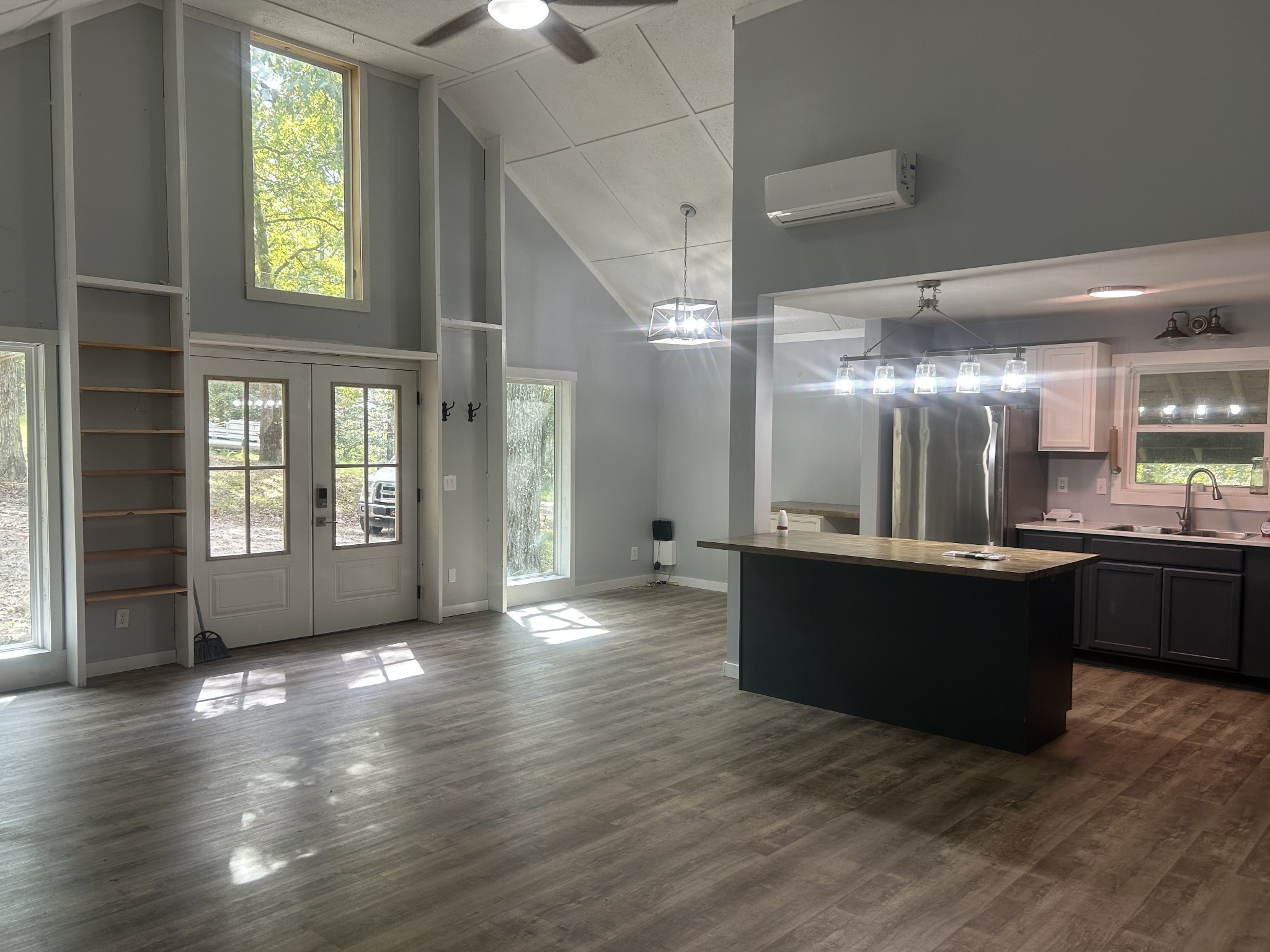 370 Alpine Road Camden, TN 38320 - Photo 7 of 20 a view of a big room with wooden floor and windows
