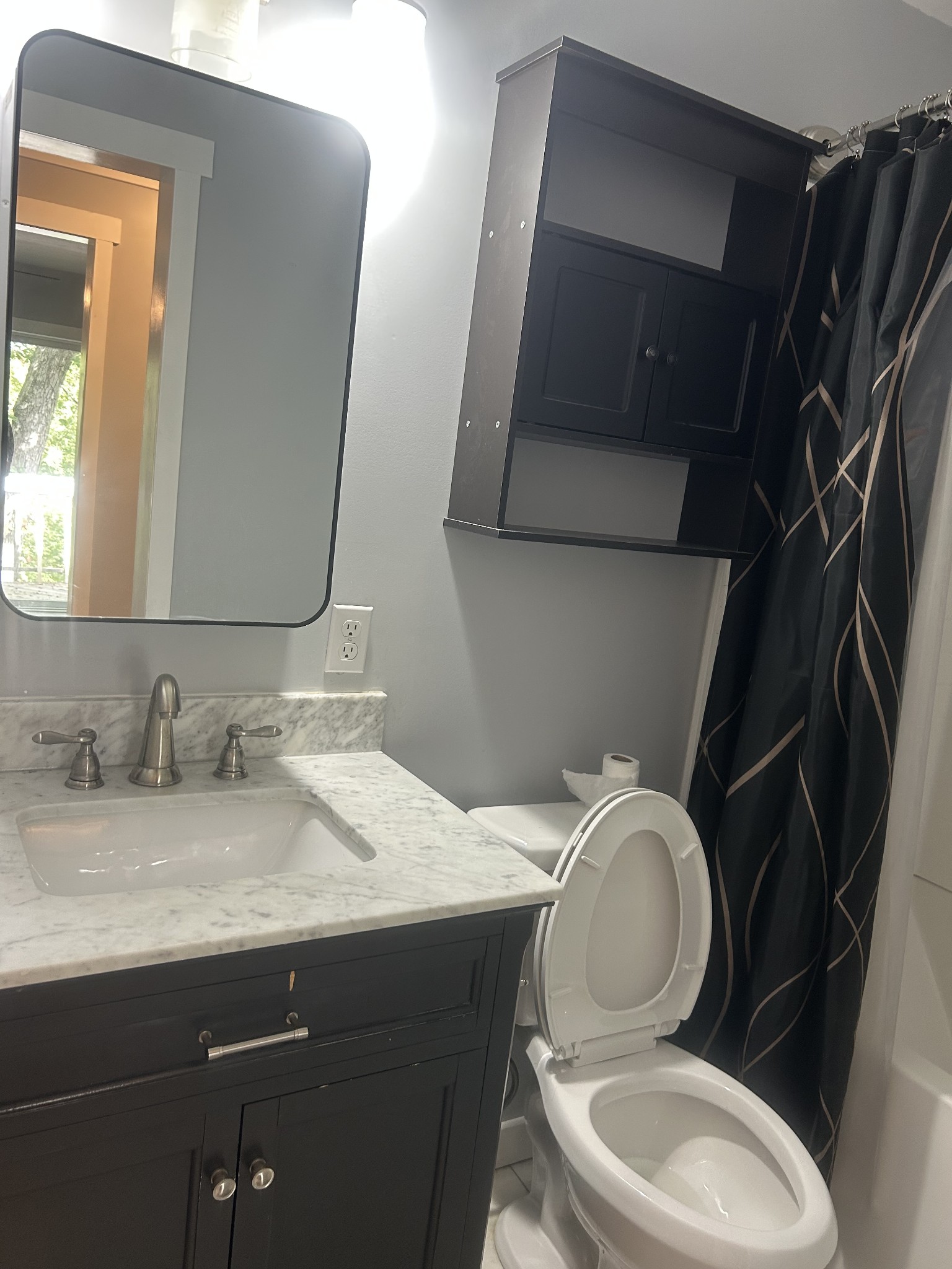 370 Alpine Road Camden, TN 38320 - Photo 10 of 20 a bathroom with a granite countertop toilet sink and mirror