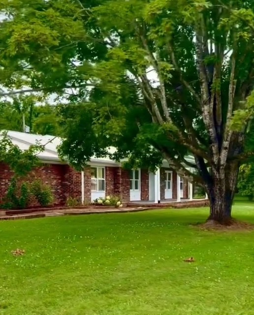 14 South Patrick Road Fayetteville, TN 37334 - Photo 45 of 45 a front view of a house with a yard table and trees