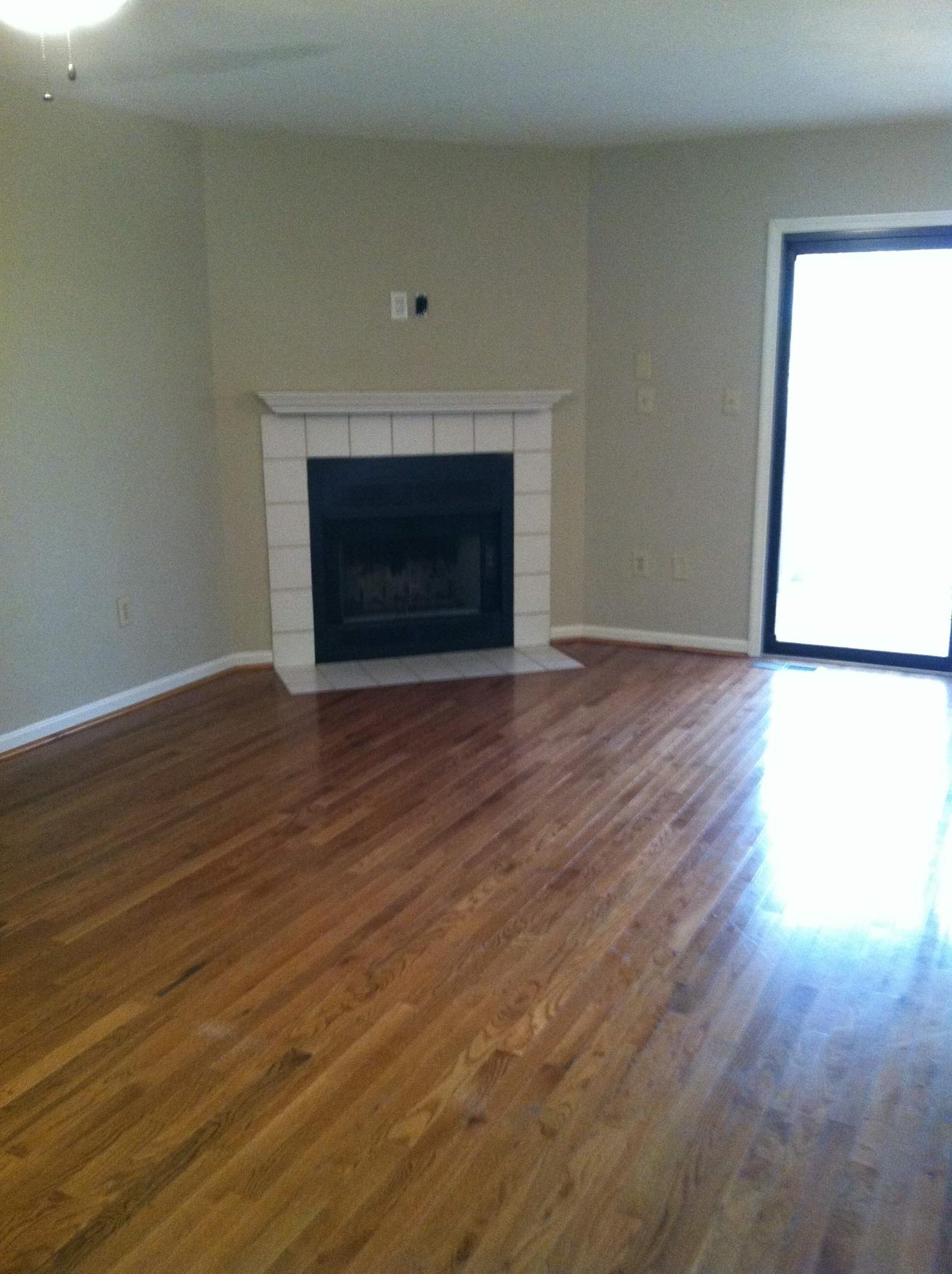 3273 Forest Ridge Road Roanoke, VA 24018 - Photo 2 of 5 a view of empty room with wooden floor and a fireplace