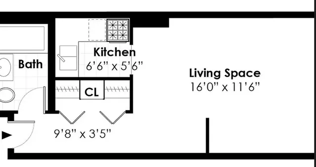 a front view of a building with a garden and plants