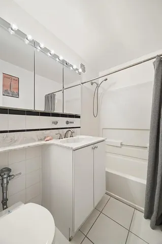 a kitchen with a stove a sink and a microwave