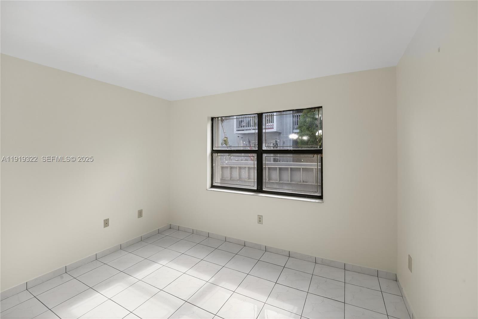 13675 Southwest 62nd Street, Unit 1023 Miami, FL 33183 - Photo 12 of 29 an empty room with windows and cabinet