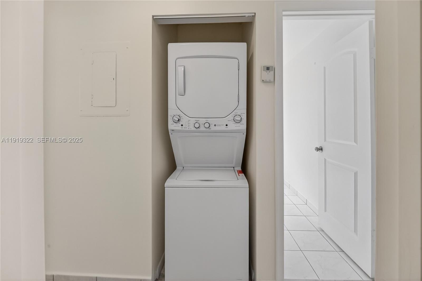 13675 Southwest 62nd Street, Unit 1023 Miami, FL 33183 - Photo 16 of 29 a view of a storage room with a washer and dryer