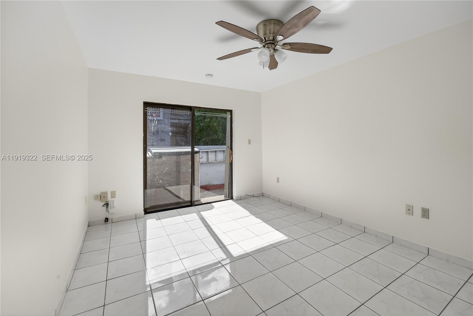13675 Southwest 62nd Street, Unit 1023 Miami, FL 33183 - Photo 19 of 29 a view of an empty room and window