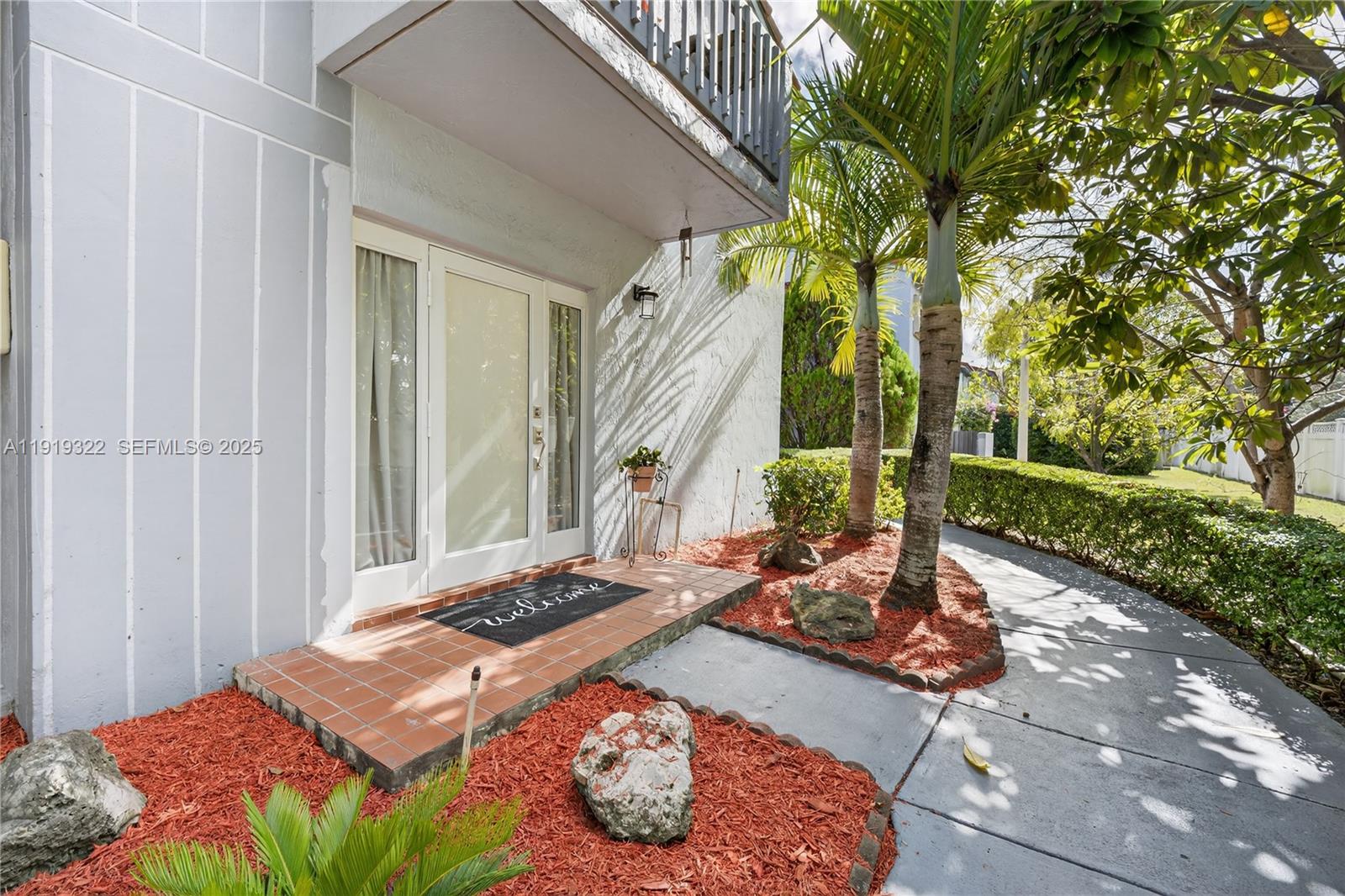 13675 Southwest 62nd Street, Unit 1023 Miami, FL 33183 - Photo 2 of 29 a bed sitting in a bedroom next to a window