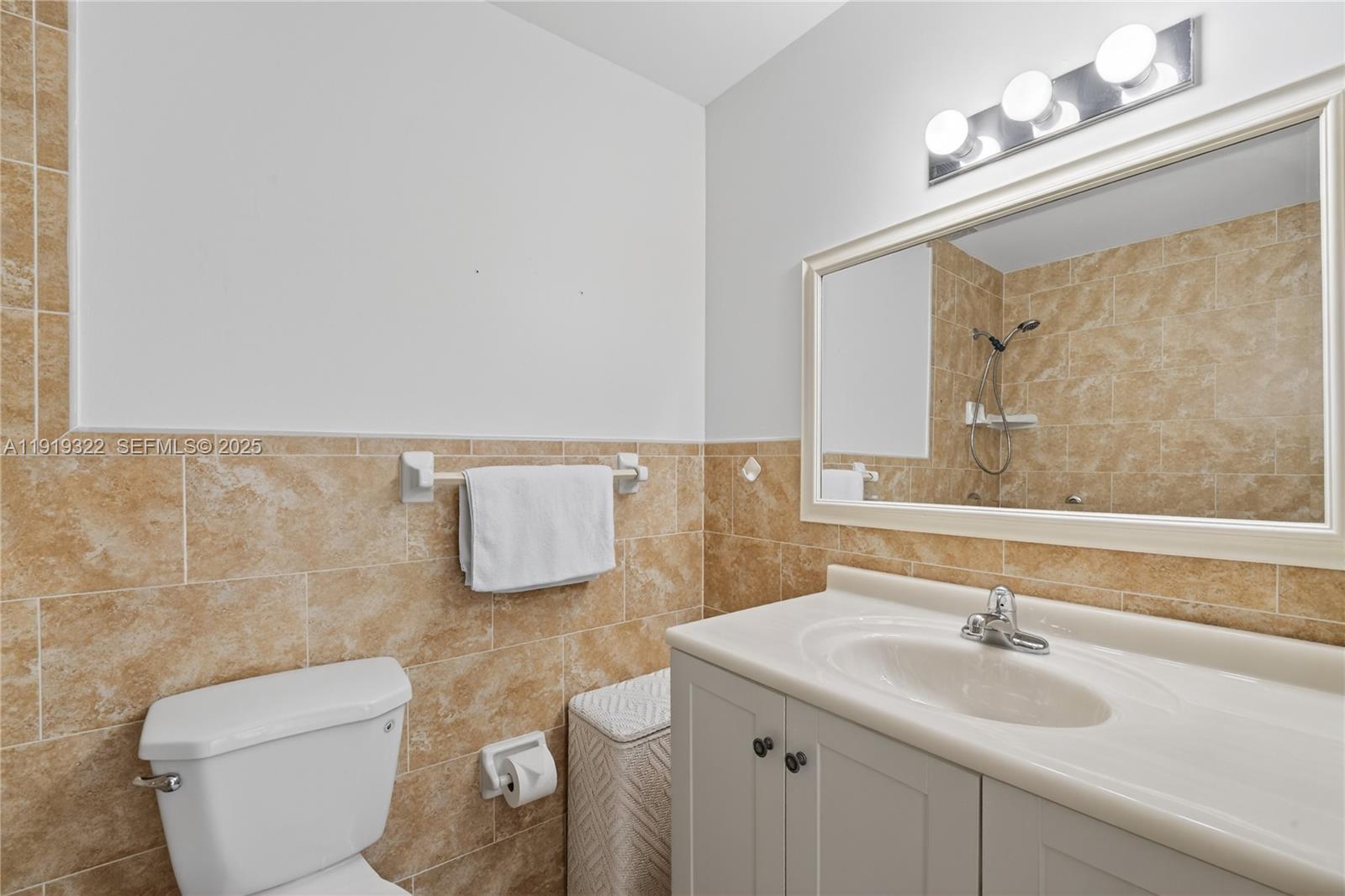13675 Southwest 62nd Street, Unit 1023 Miami, FL 33183 - Photo 22 of 29 a bathroom with a sink and a mirror
