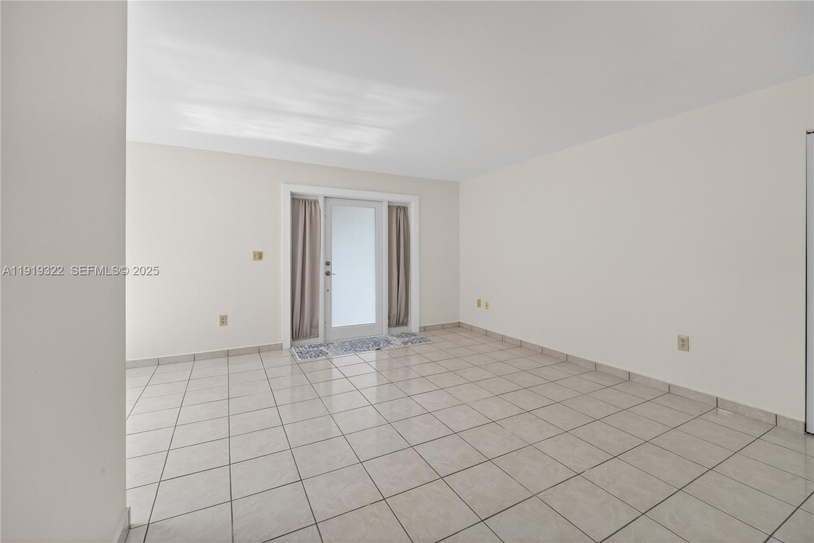 13675 Southwest 62nd Street, Unit 1023 Miami, FL 33183 - Photo 5 of 29 a view of an empty room and window