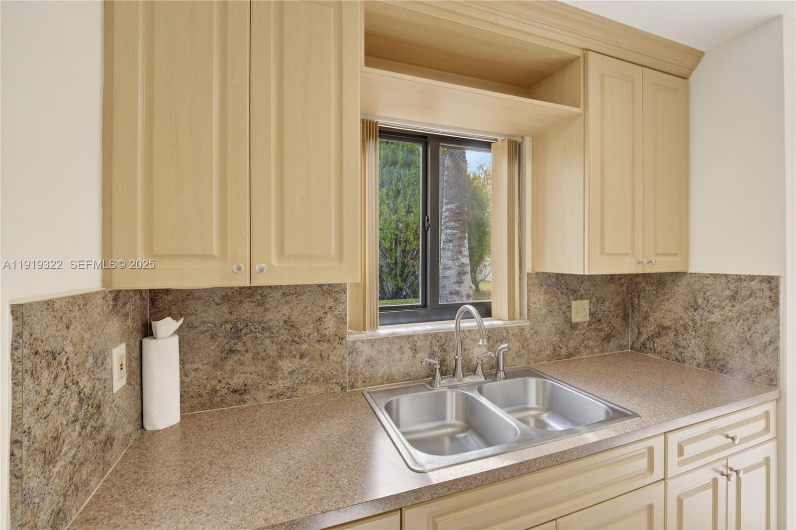 13675 Southwest 62nd Street, Unit 1023 Miami, FL 33183 - Photo 8 of 29 a kitchen with a sink and cabinets