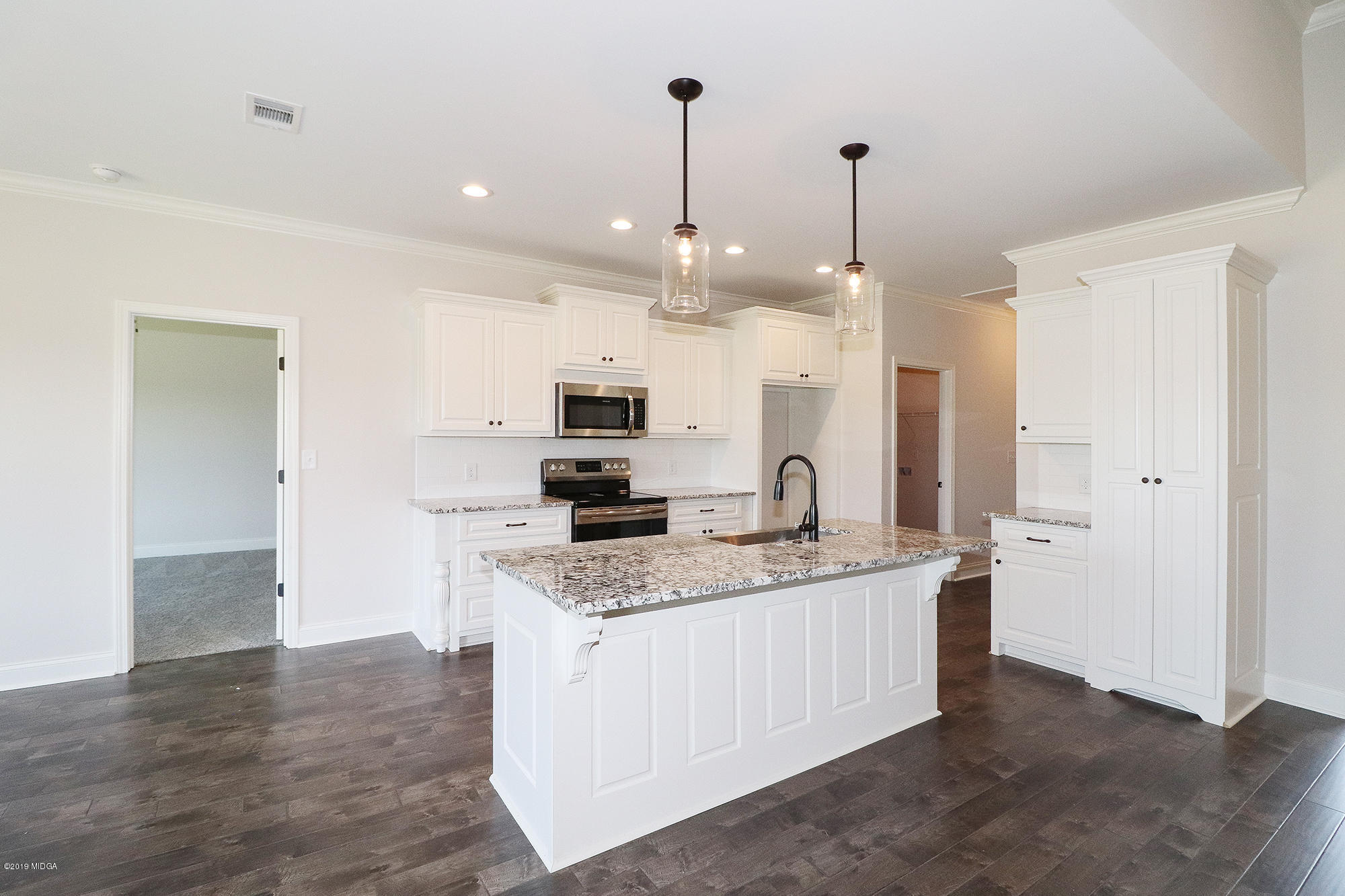 109 Timber Ridge Circle Byron, GA 31008 - Photo 14 of 45 a kitchen with kitchen island granite countertop a sink a counter top space stainless steel appliances and cabinets