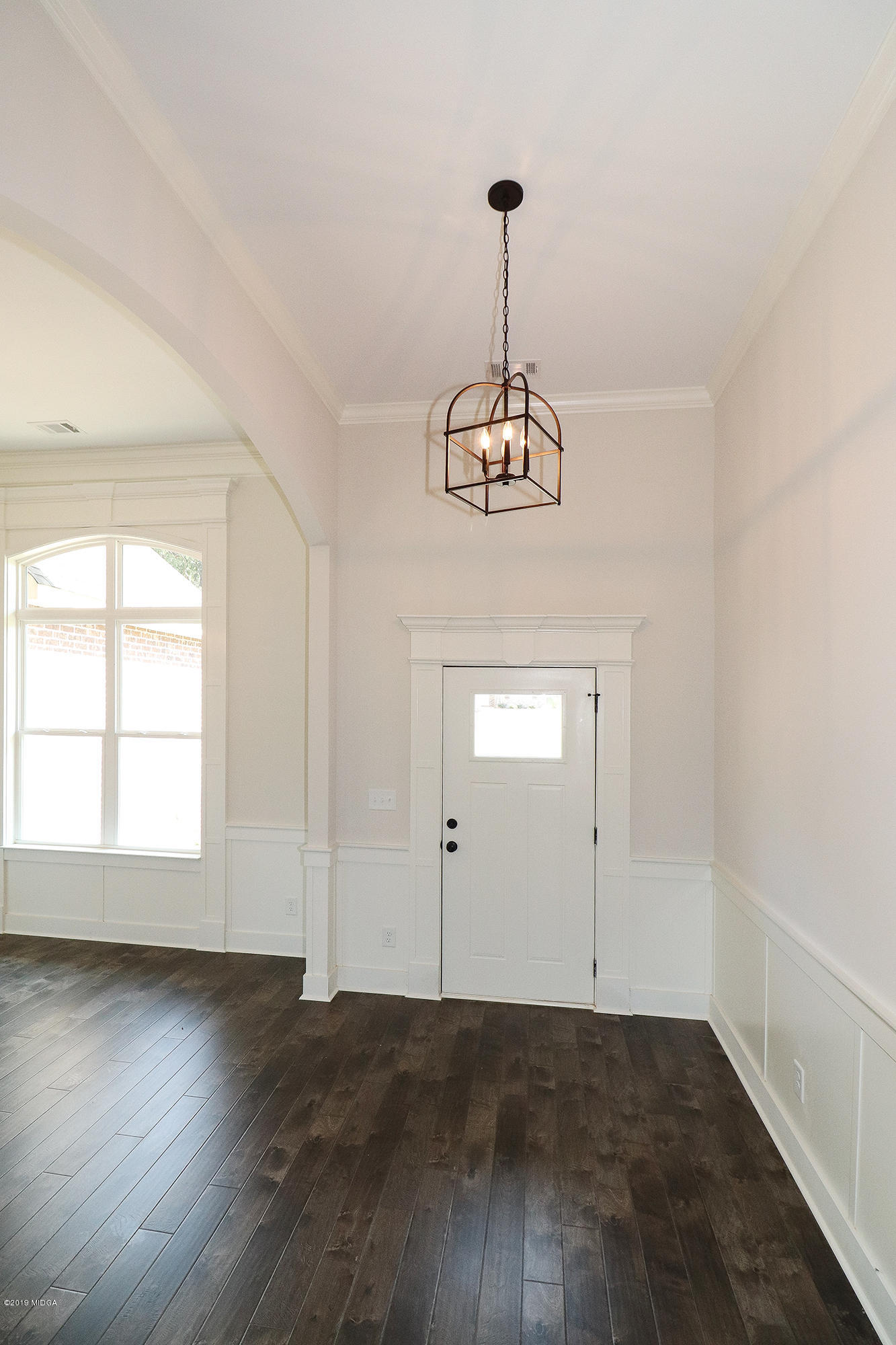 109 Timber Ridge Circle Byron, GA 31008 - Photo 3 of 45 an empty room with wooden floor and windows