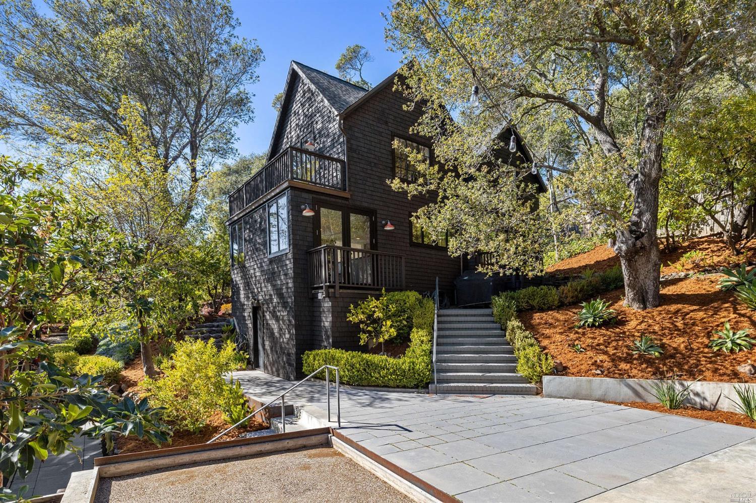 a view of a pathway of a house along with trees