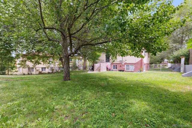 a couple of table and chairs sitting in the grass