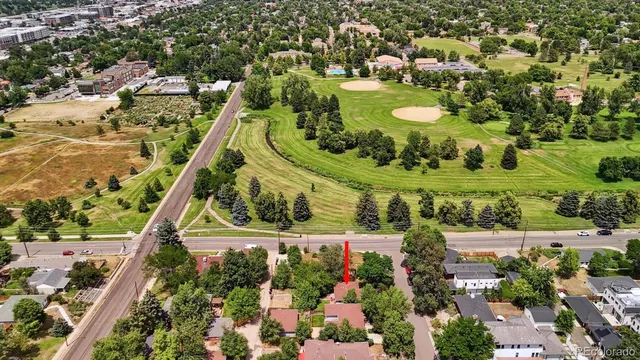 a view of a garden with a house