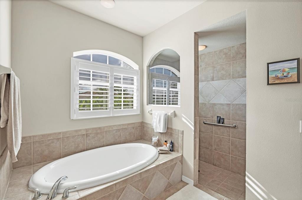 4 Windward Way Placida, FL 33946 - Photo 28 of 39 a bath tub sitting in a bathroom next to a window
